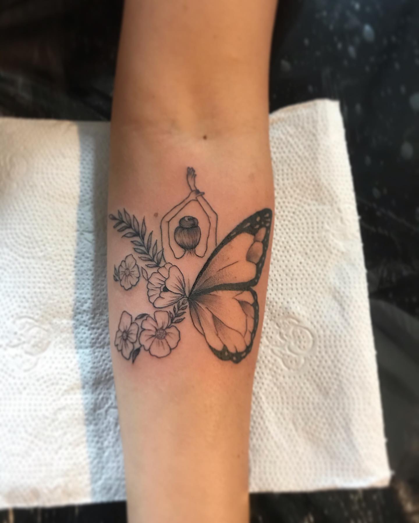 Butterfly and yoga pose black and grey tattoo on the forearm by PrimaTa’ttoo_021