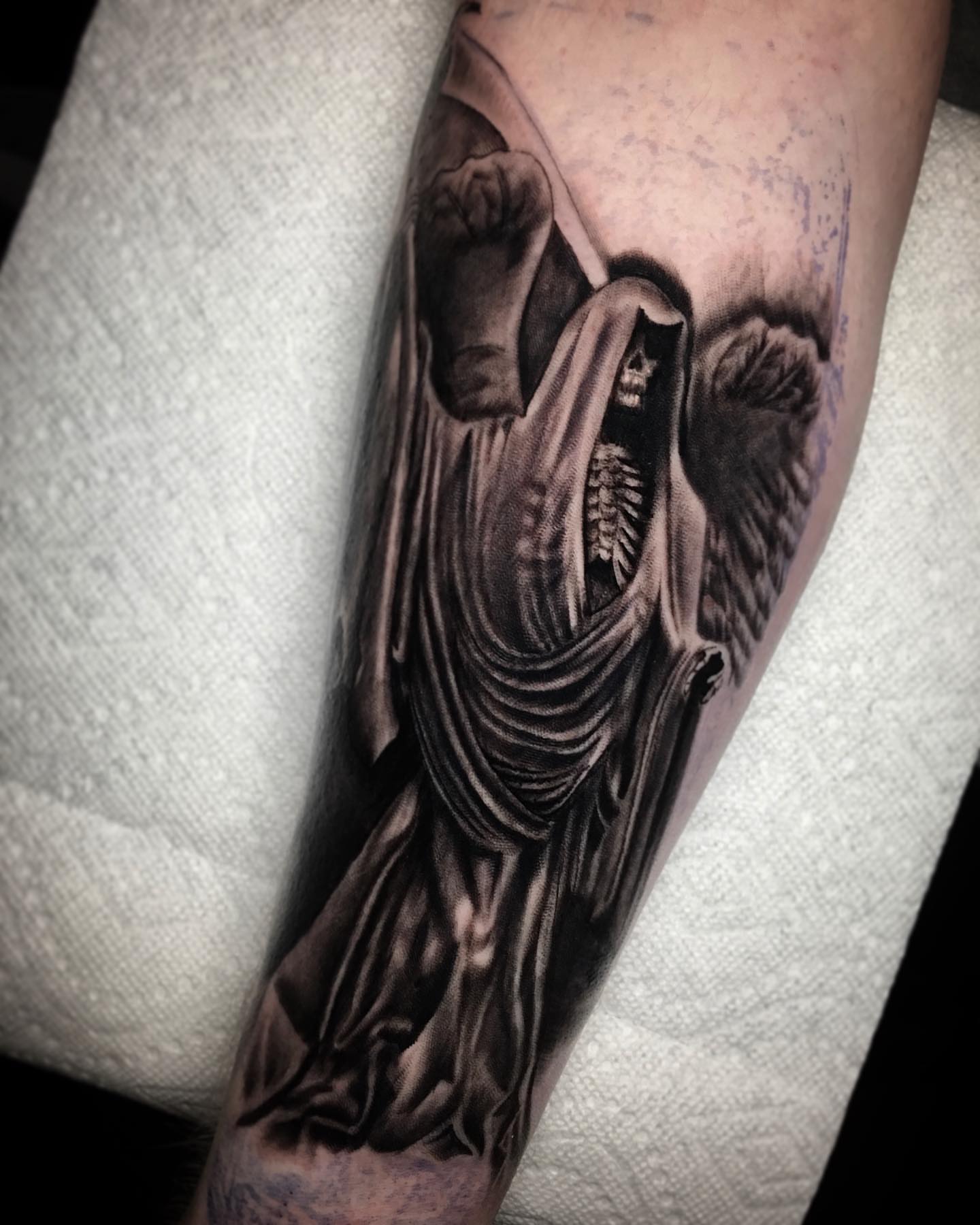 Skeleton angel dark realism tattoo on the forearm by Dalton King Pensacola Tattooer