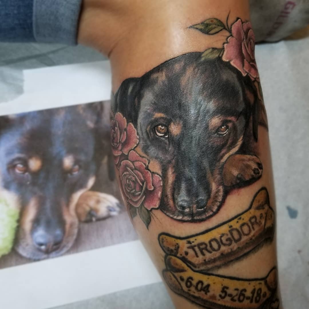 Dog portrait realism tattoo on the forearm by Neil Ohmie