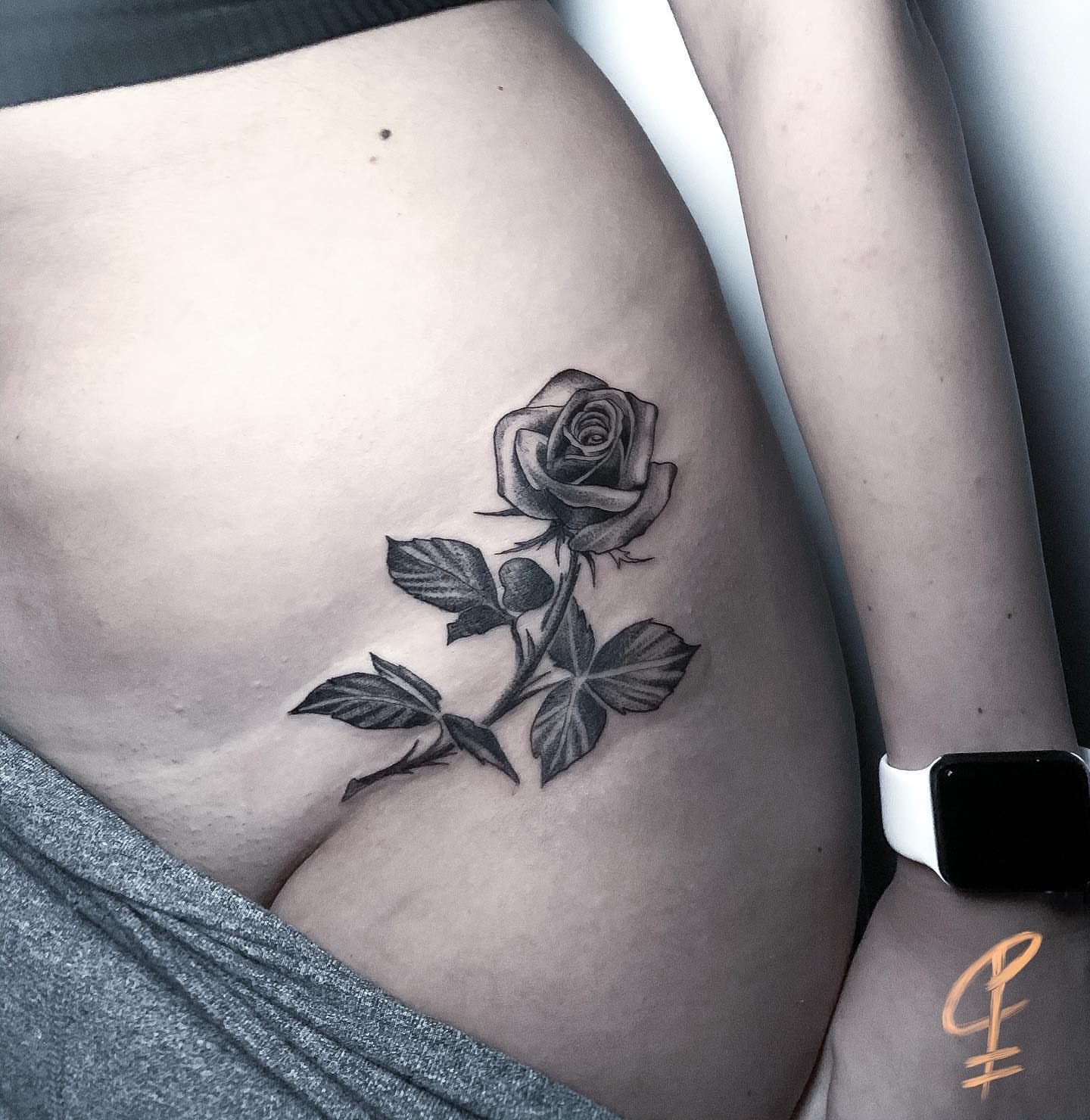 Rose black and grey tattoo on the thigh by Christian Pelaez
