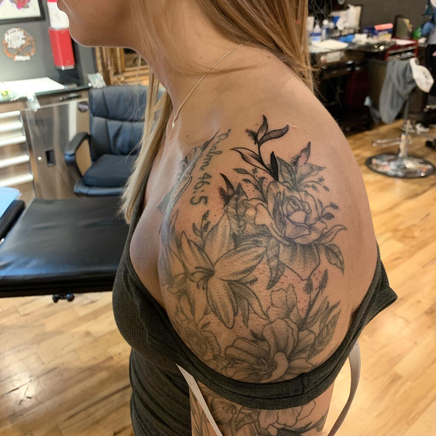 Floral arrangement black and grey tattoo on the shoulder by Jeff Kees