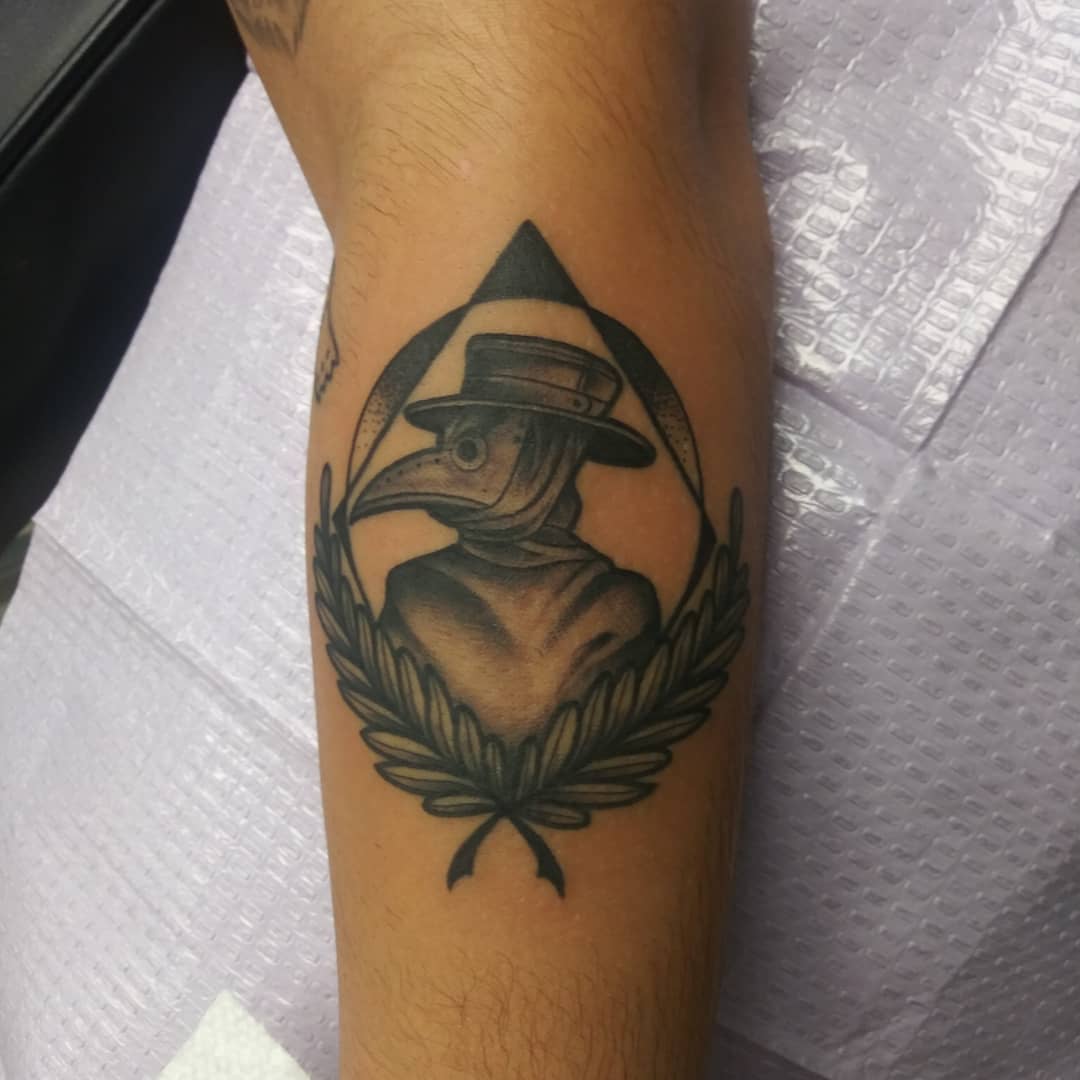Plague doctor black and grey tattoo on the forearm by Herc