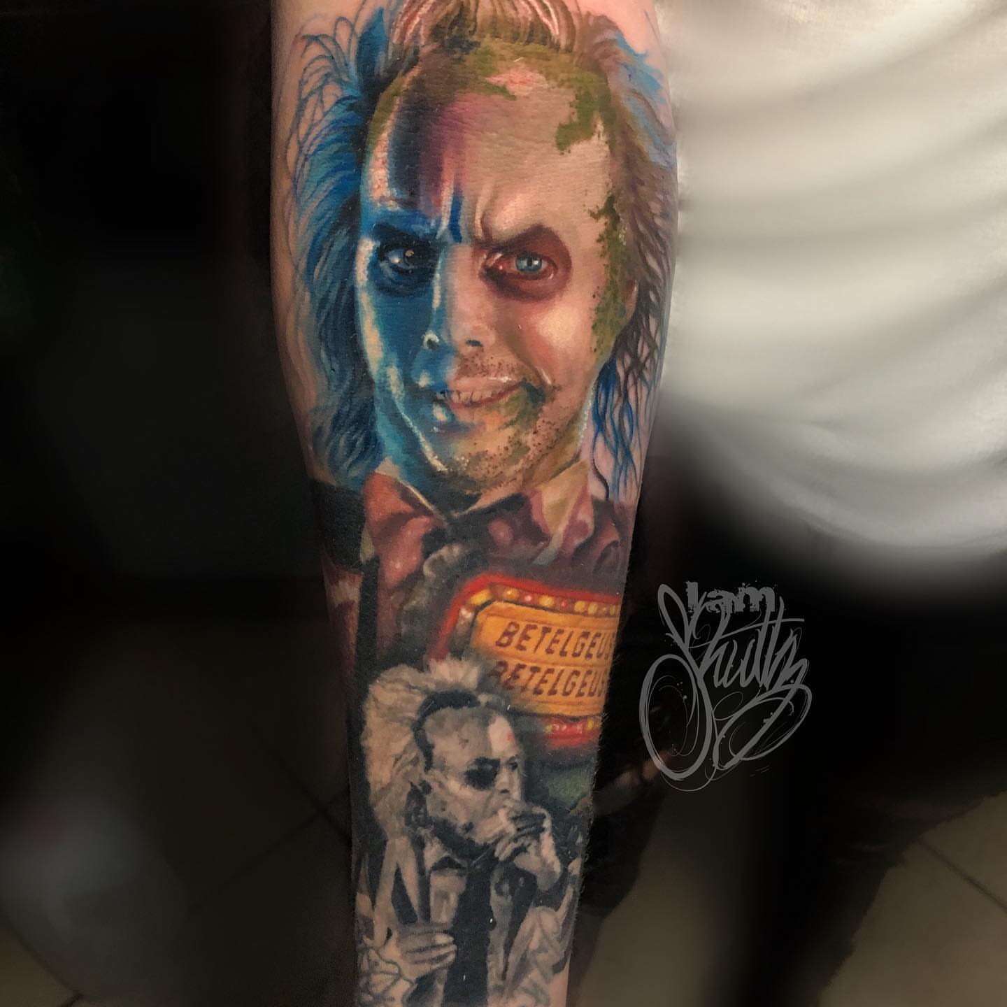 Joker realism tattoo on the forearm by Mike Shultz