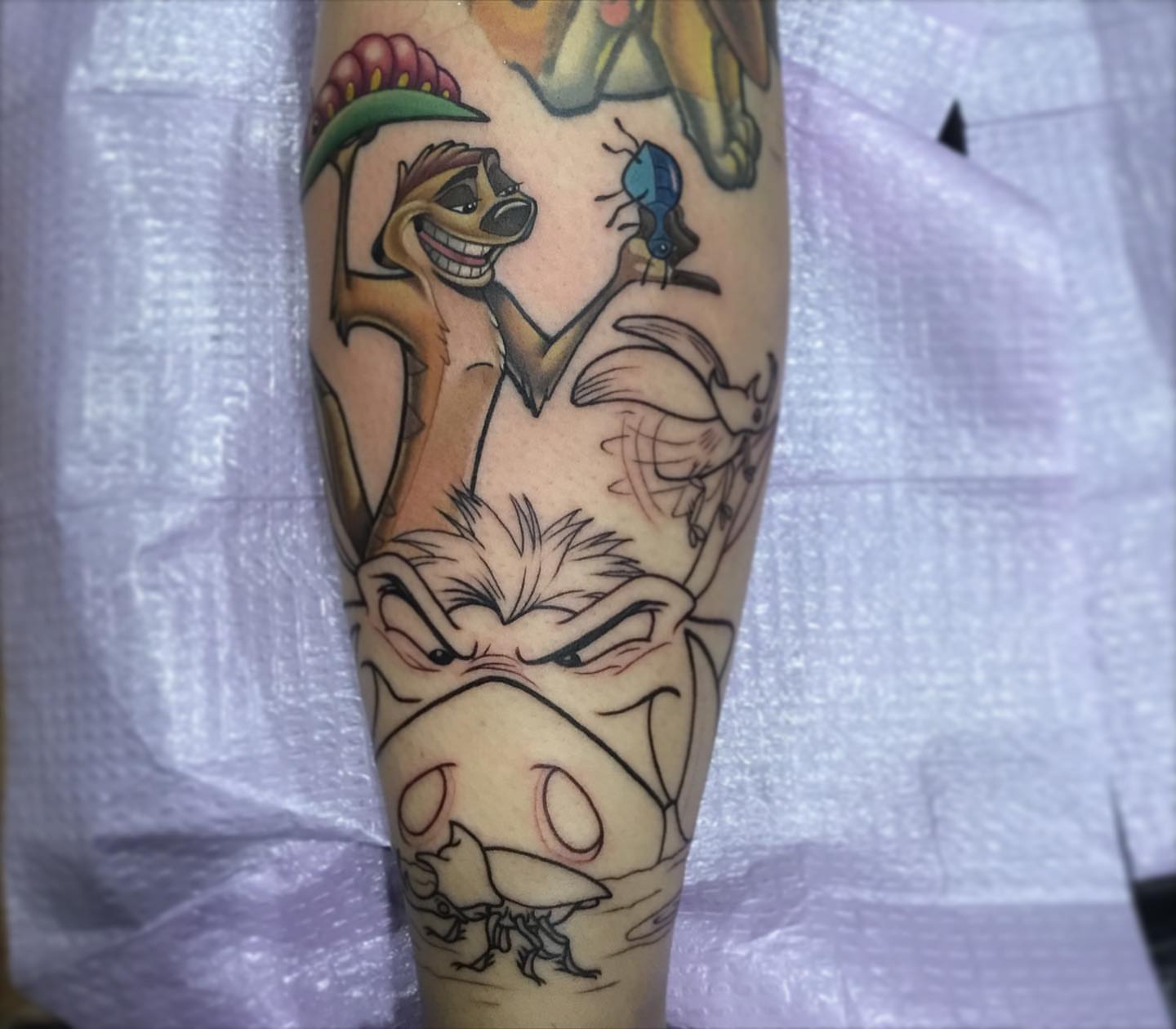 Animal characters illustrative tattoo on the forearm by Ariel Robinson