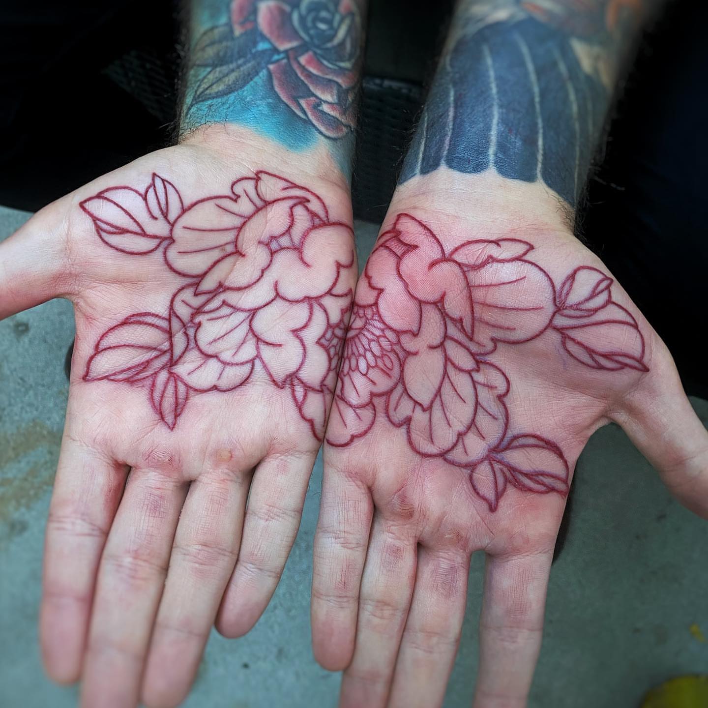Floral bouquet American traditional tattoo on the hand by Mark Walker