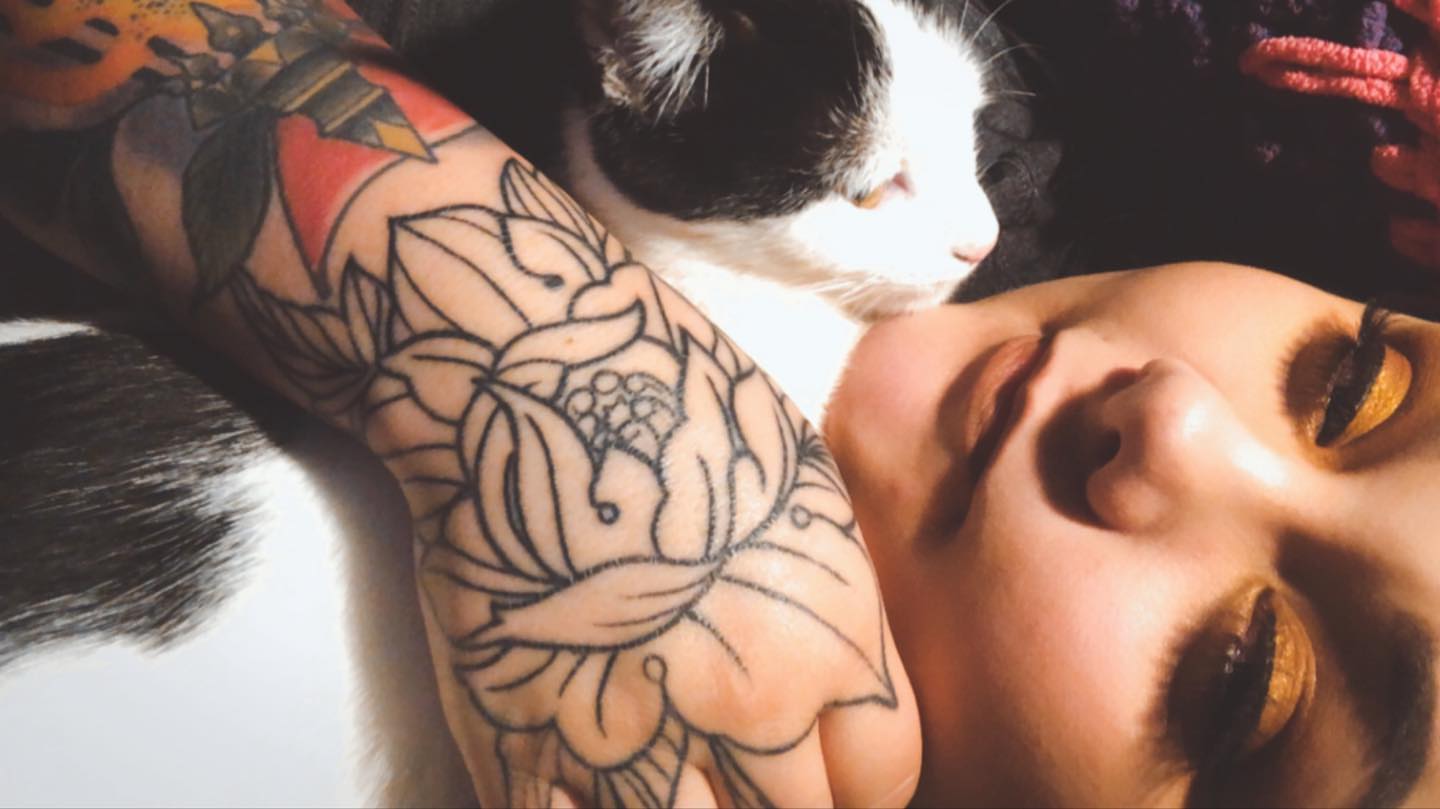 Lotus flower American traditional tattoo on the forearm by Sally Darling