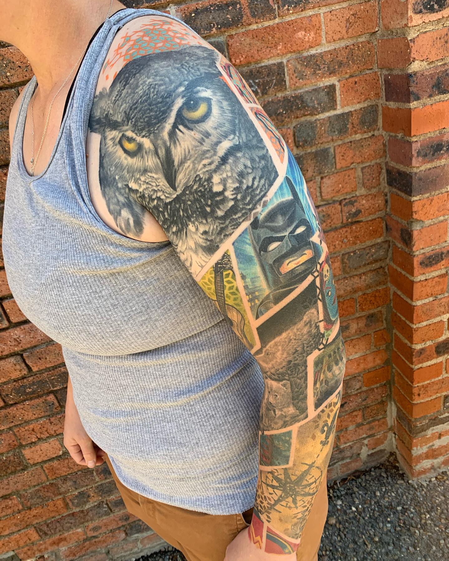 Owl realism tattoo on the upper arm by Ben Viamontes