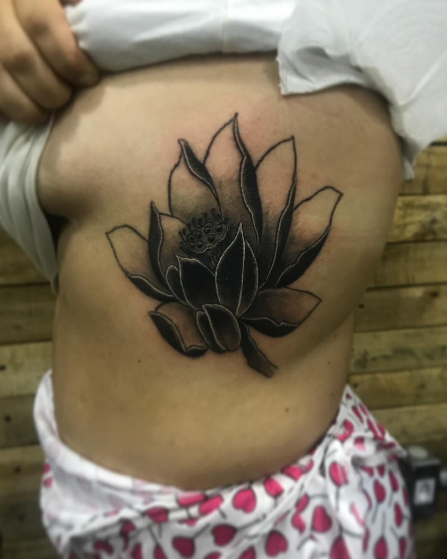 Lotus flower black and grey tattoo on the ribs by PrimaTa’ttoo_021