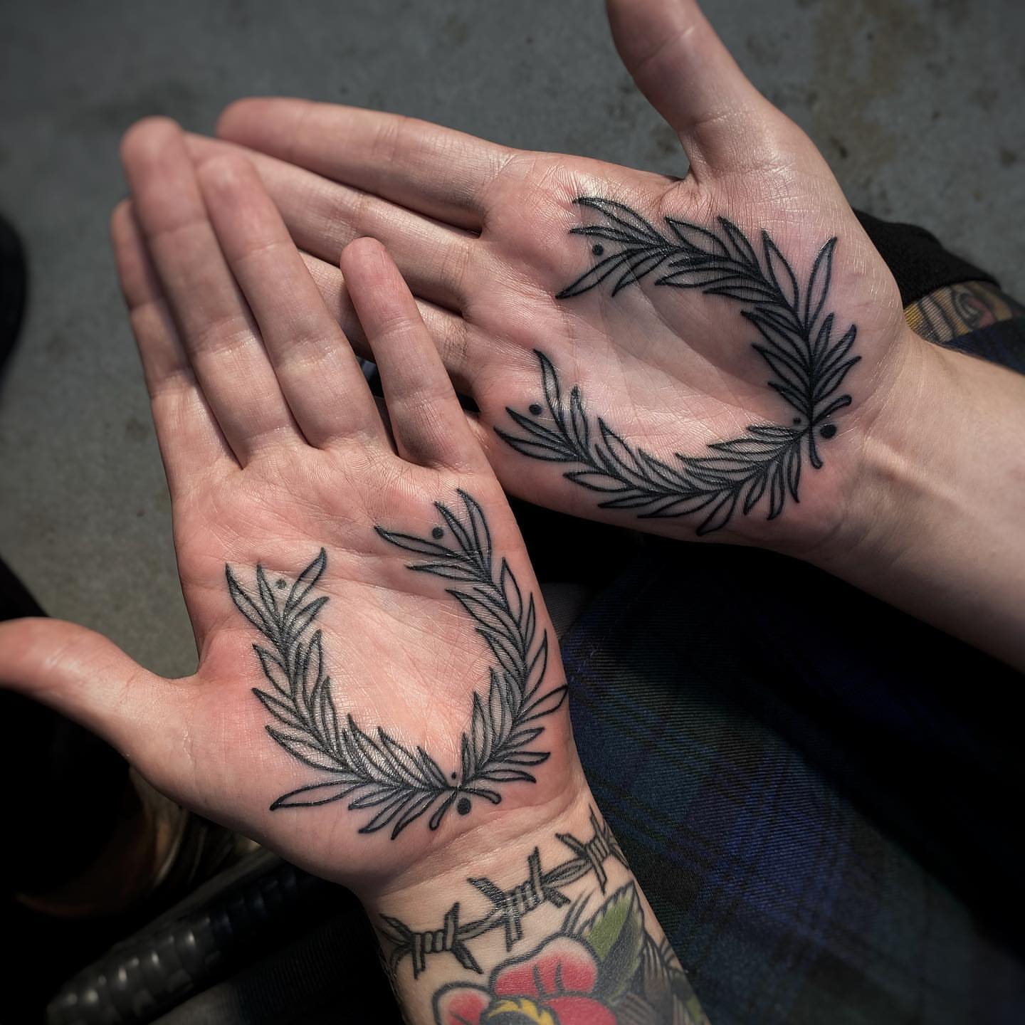 Wreath black and grey tattoo on the hand by Mark Walker