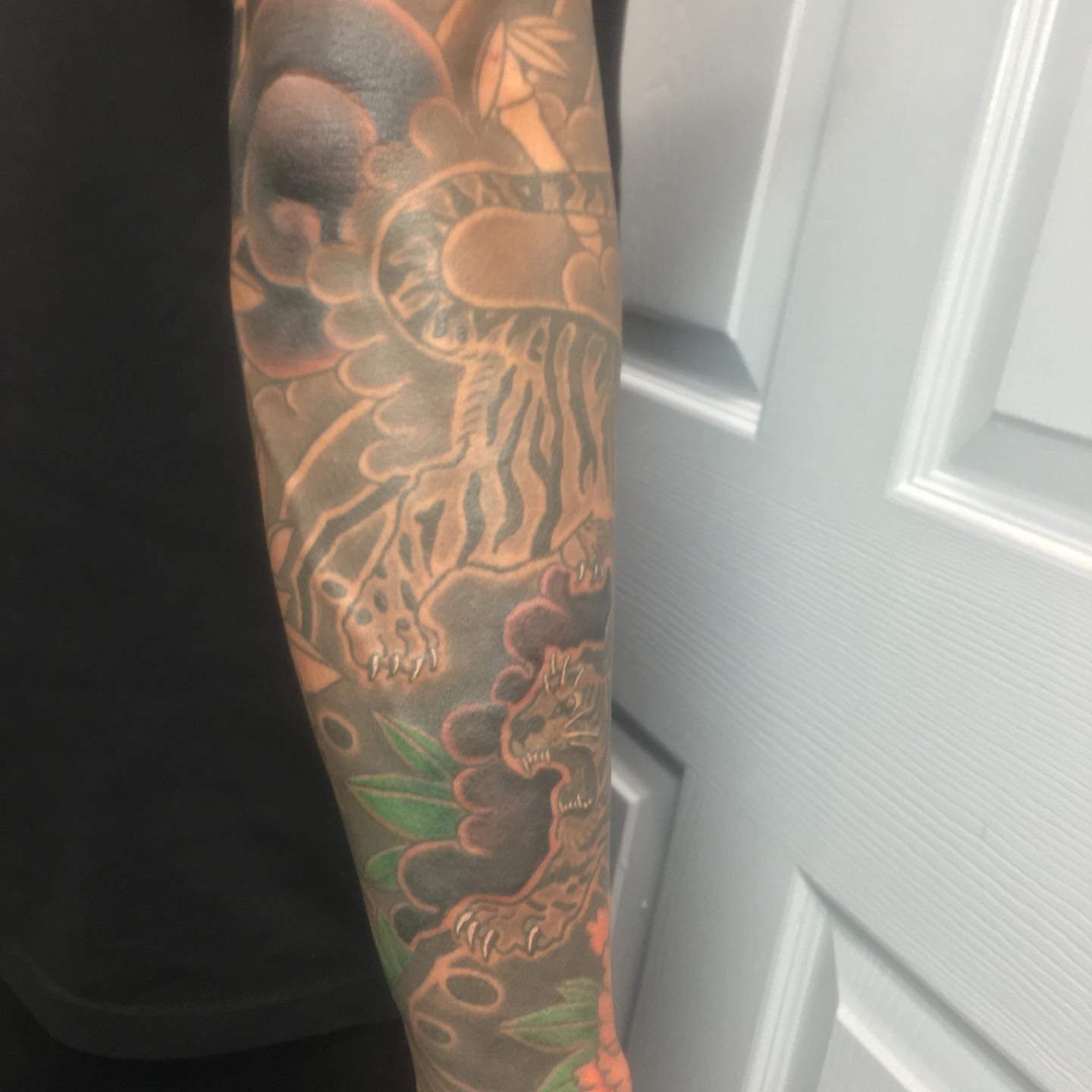 Tiger and sun japanese irezumi tattoo on the forearm by Ei Horimiya Omiya