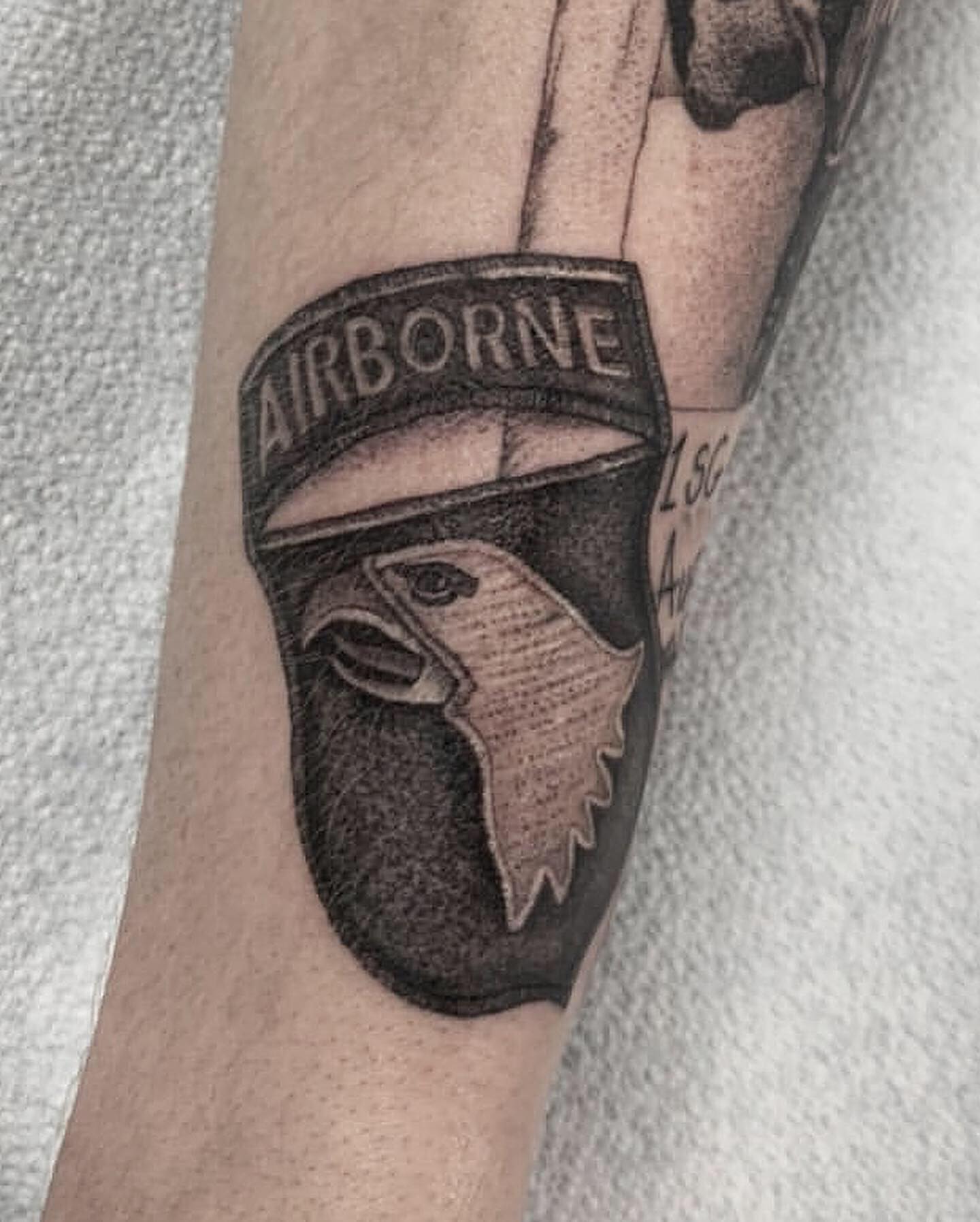 Airborne helmet black and grey tattoo on the forearm by Adrian Dominguez, Las Vegas, Nevada