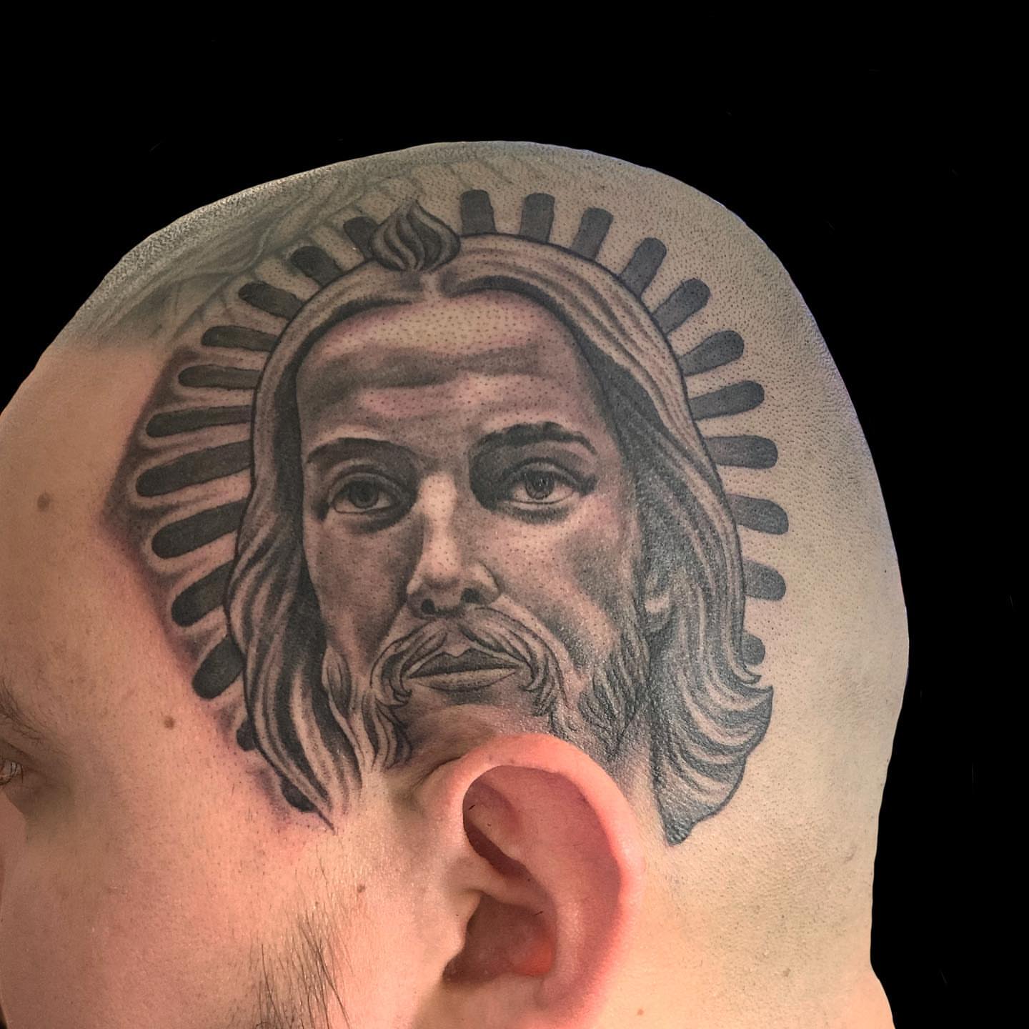 Religious figure black and grey tattoo on the head by Artfabn