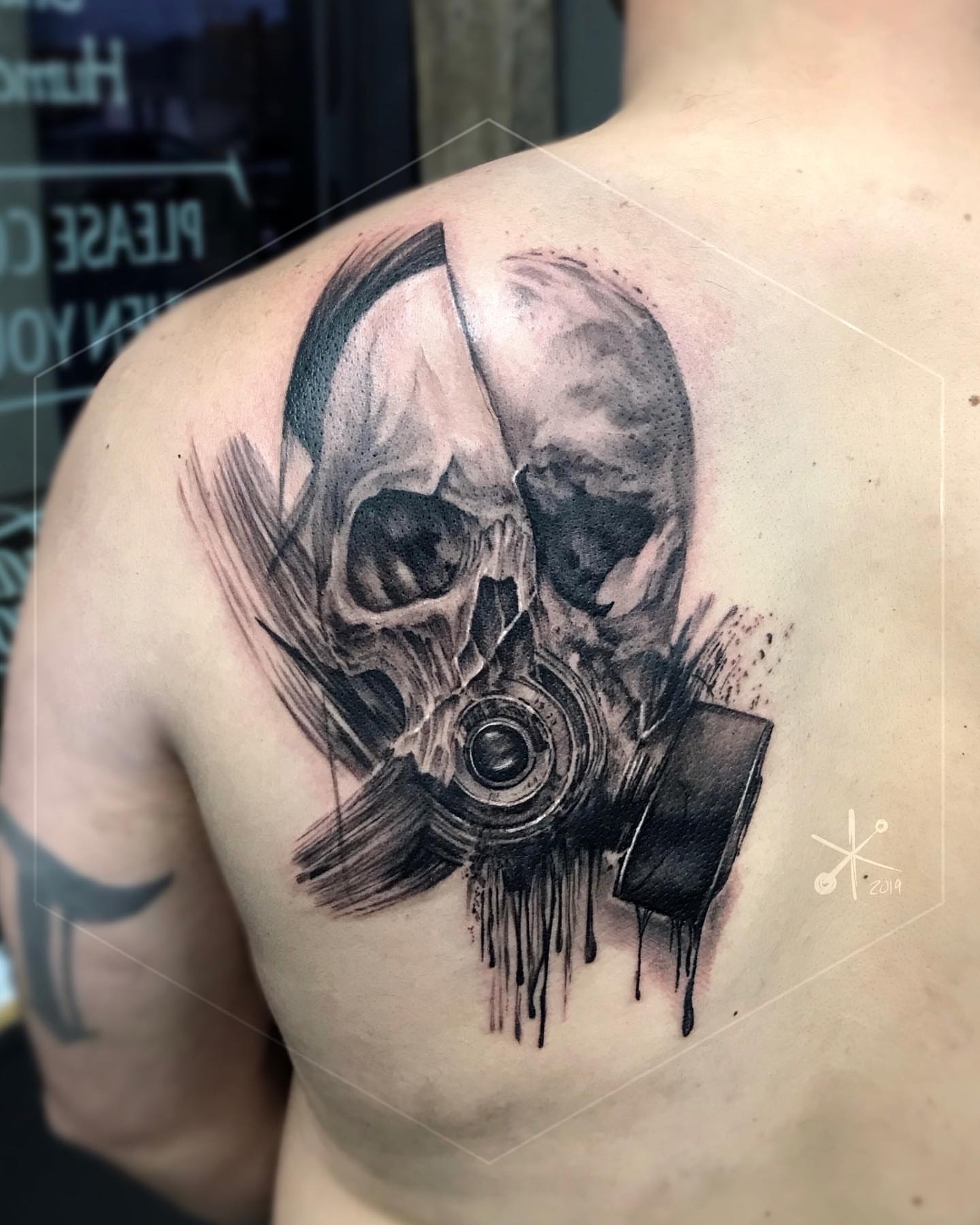 Skull with gas mask realism tattoo on the shoulder by Jax Citriglia