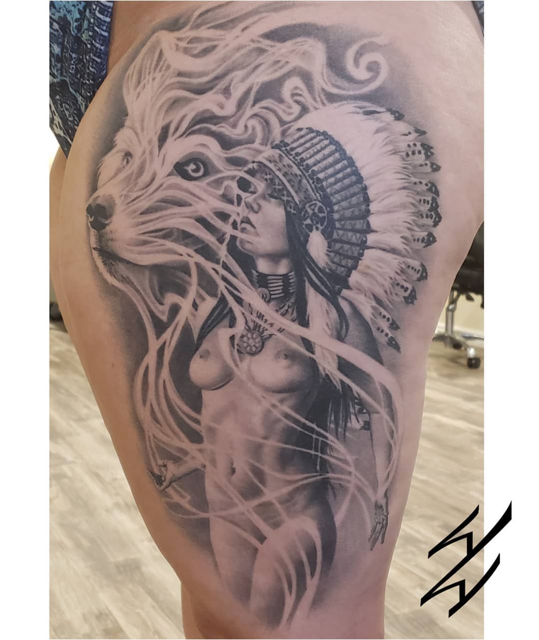 Native woman with wolf realism tattoo on the thigh by Walt Watts, Salt Lake City, Utah