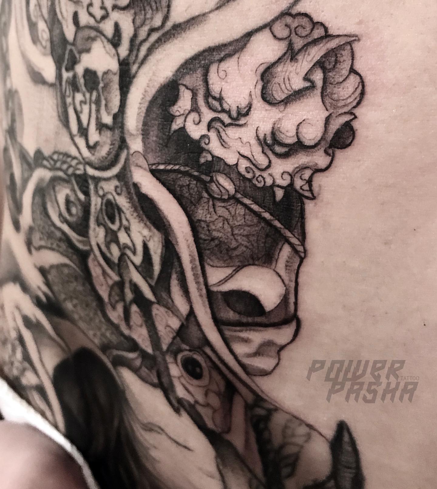 Lion black and grey tattoo on the shoulder by Tattoo San Diego