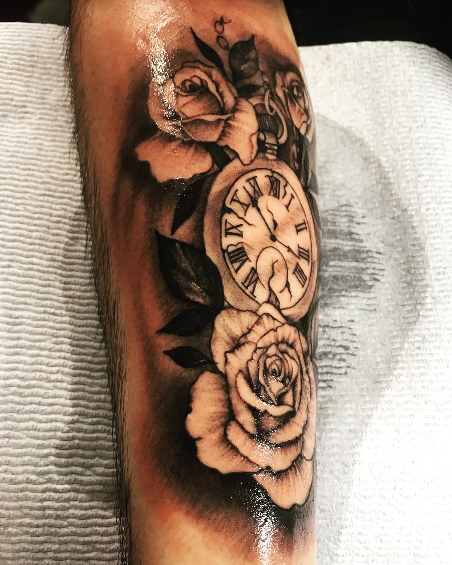 Roses and pocket watch realism tattoo on the forearm by Felix perez (Tattooer)
