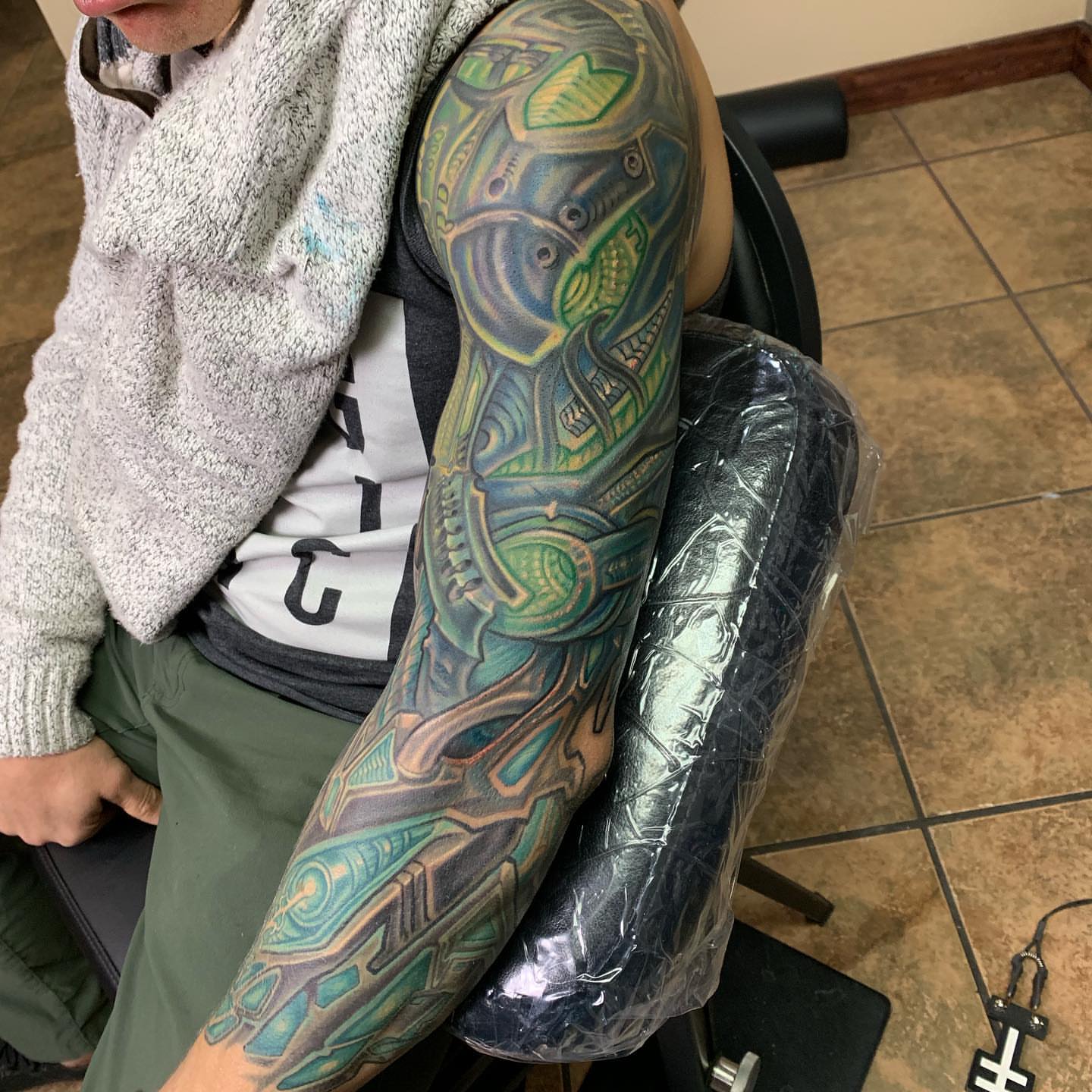 Cyborg armor geometric tattoo on the upper arm by Phil Robertson