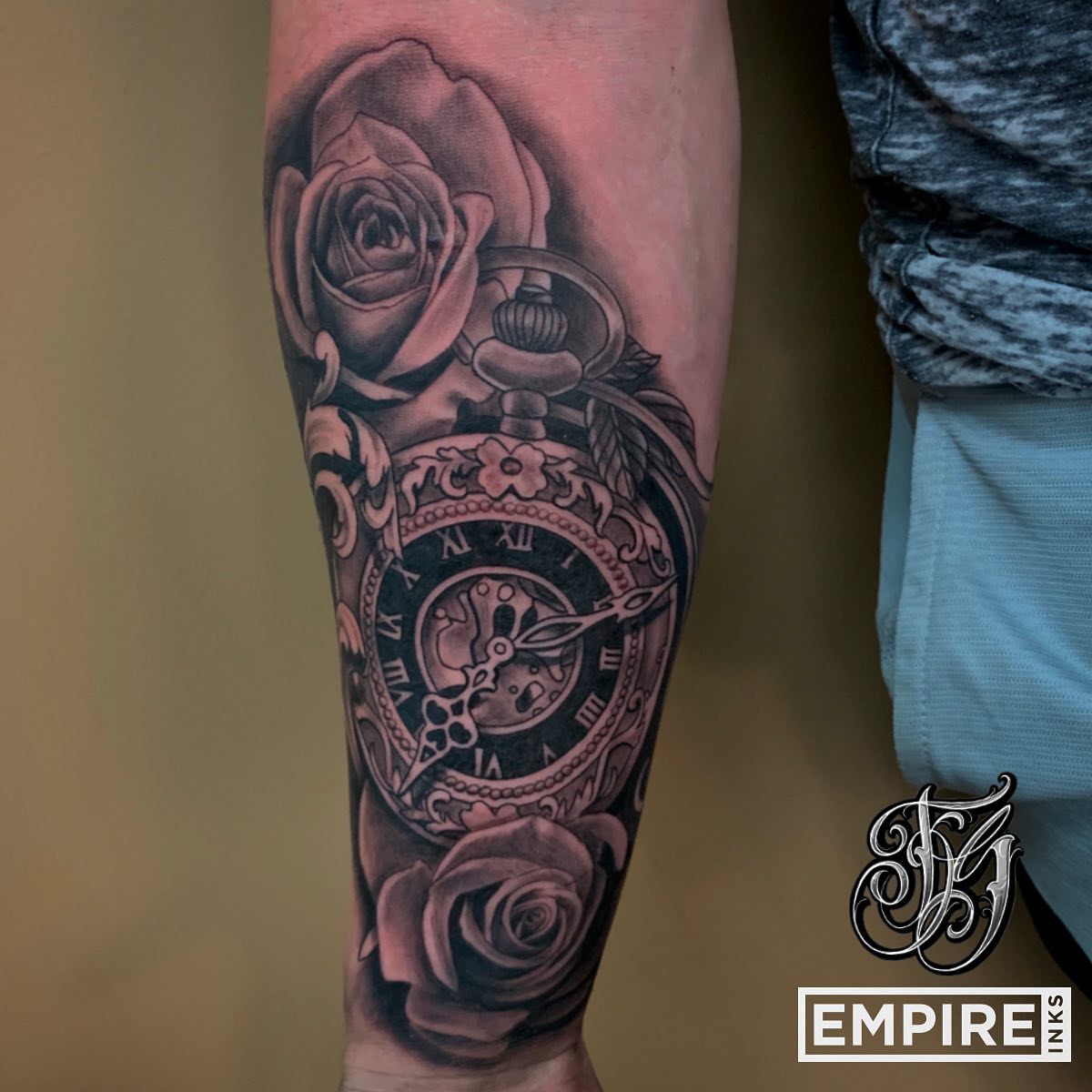 Clock and roses realism tattoo on the forearm by Joe Shepp