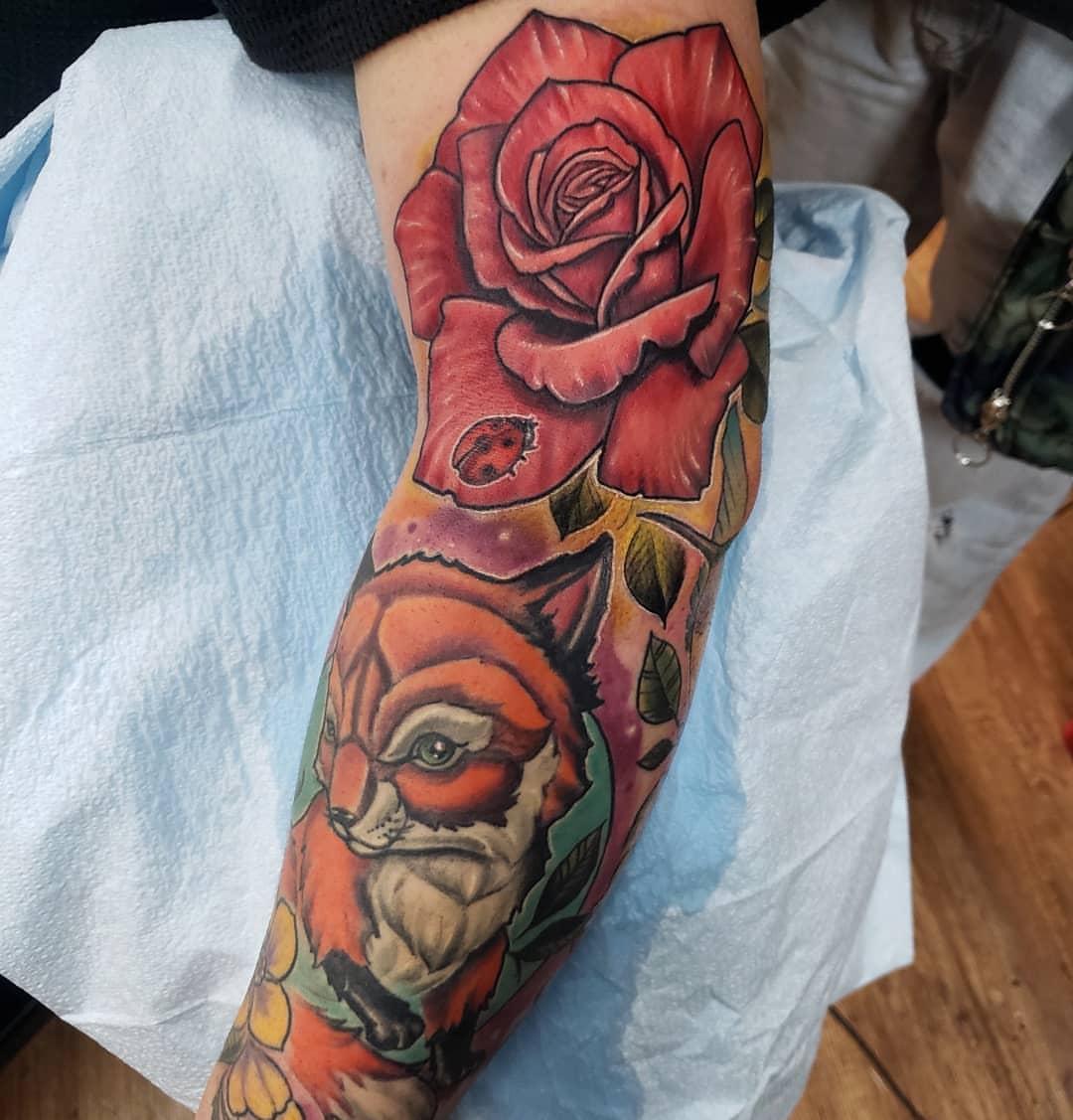 Red rose and fox American traditional tattoo on the forearm by Greg West Sac tattoo artist, West Sacramento, California