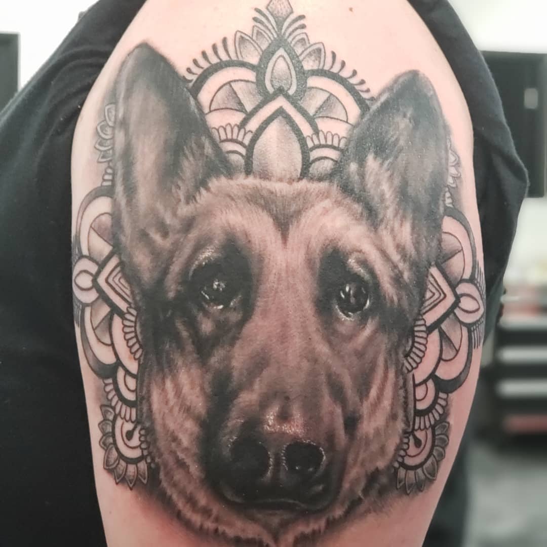 Dog realism tattoo on the forearm by Jon Goad
