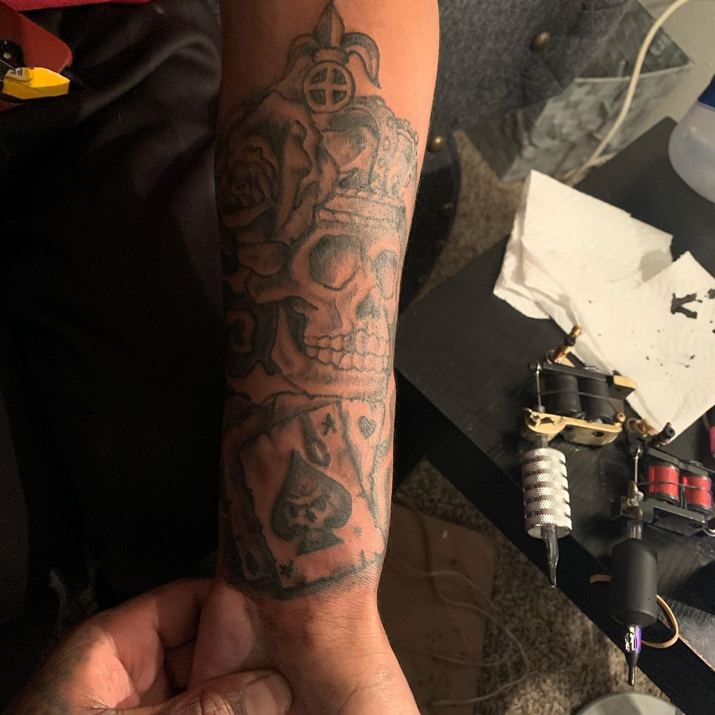 Skull and playing card American traditional tattoo on the forearm by Deangelo Inkcrazy Dukes