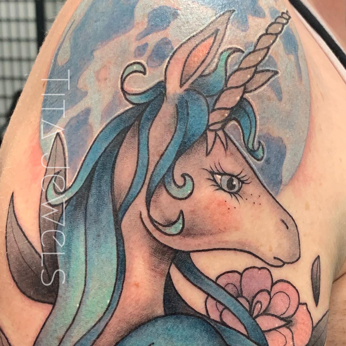 Unicorn watercolor tattoo on the shoulder by Tita Jewels- Tattoo Artist, Austin, Texas