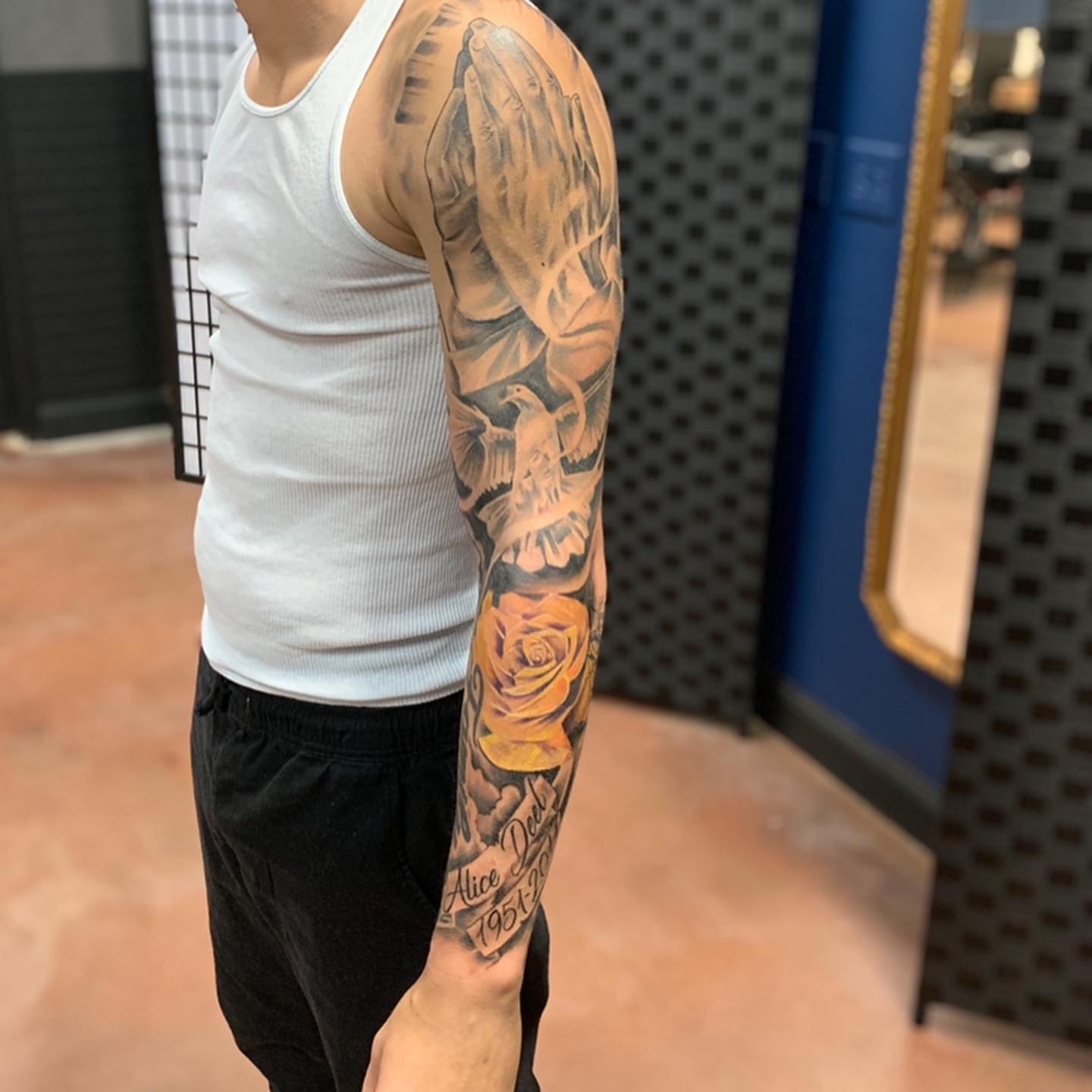 Praying hands with dove and rose realism tattoo on the forearm by Mikeyftsk2