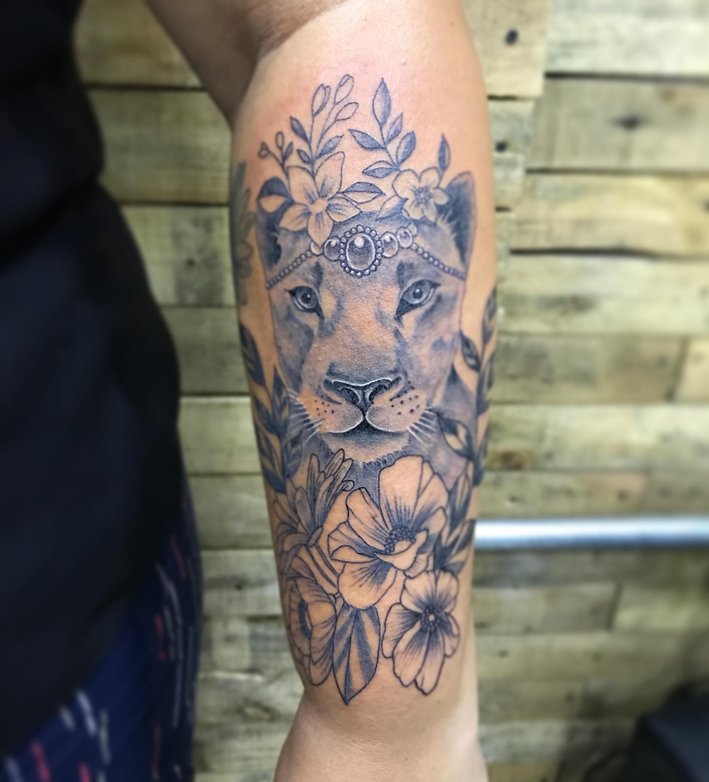 Lioness with floral crown realism tattoo on the forearm by PrimaTa’ttoo_021