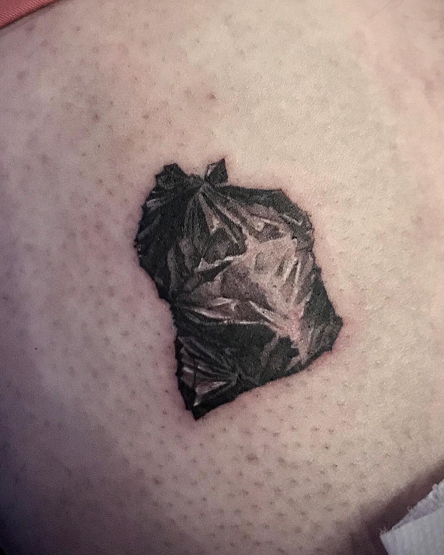 Garbage bag black and grey tattoo by Tattoo San Diego