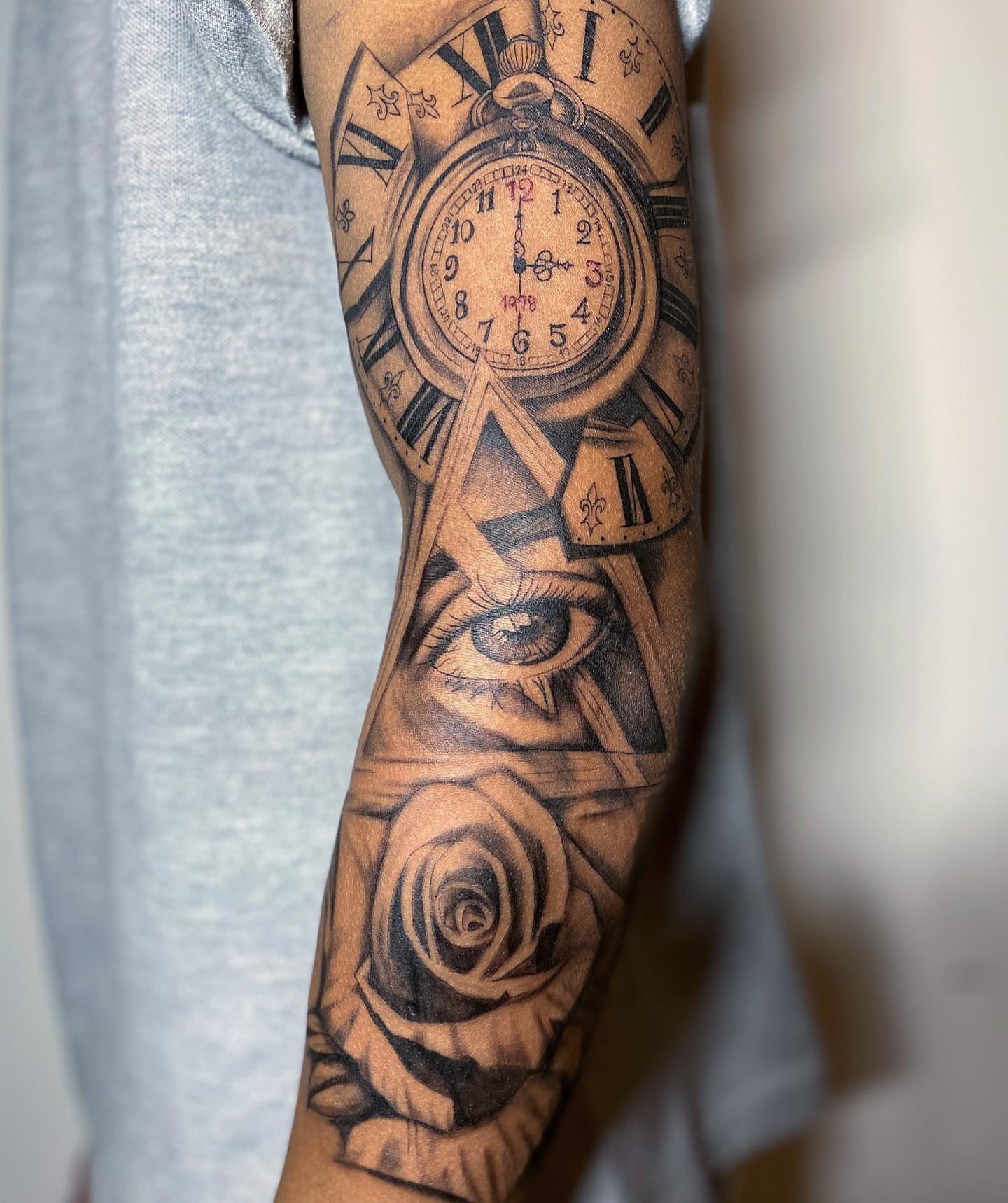 Clock and eye realism tattoo on the forearm by Nj Tattoo Artist Inkdyou, Bloomfield, New Jersey