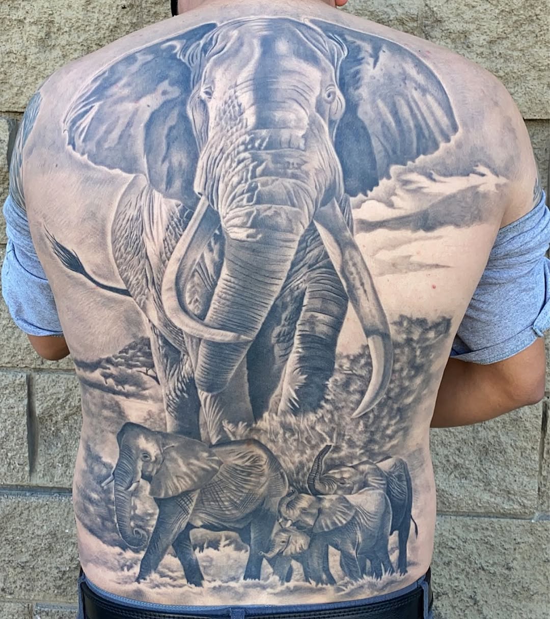 Elephants in landscape Chicano tattoo on the back by El Pato, San Jose, California