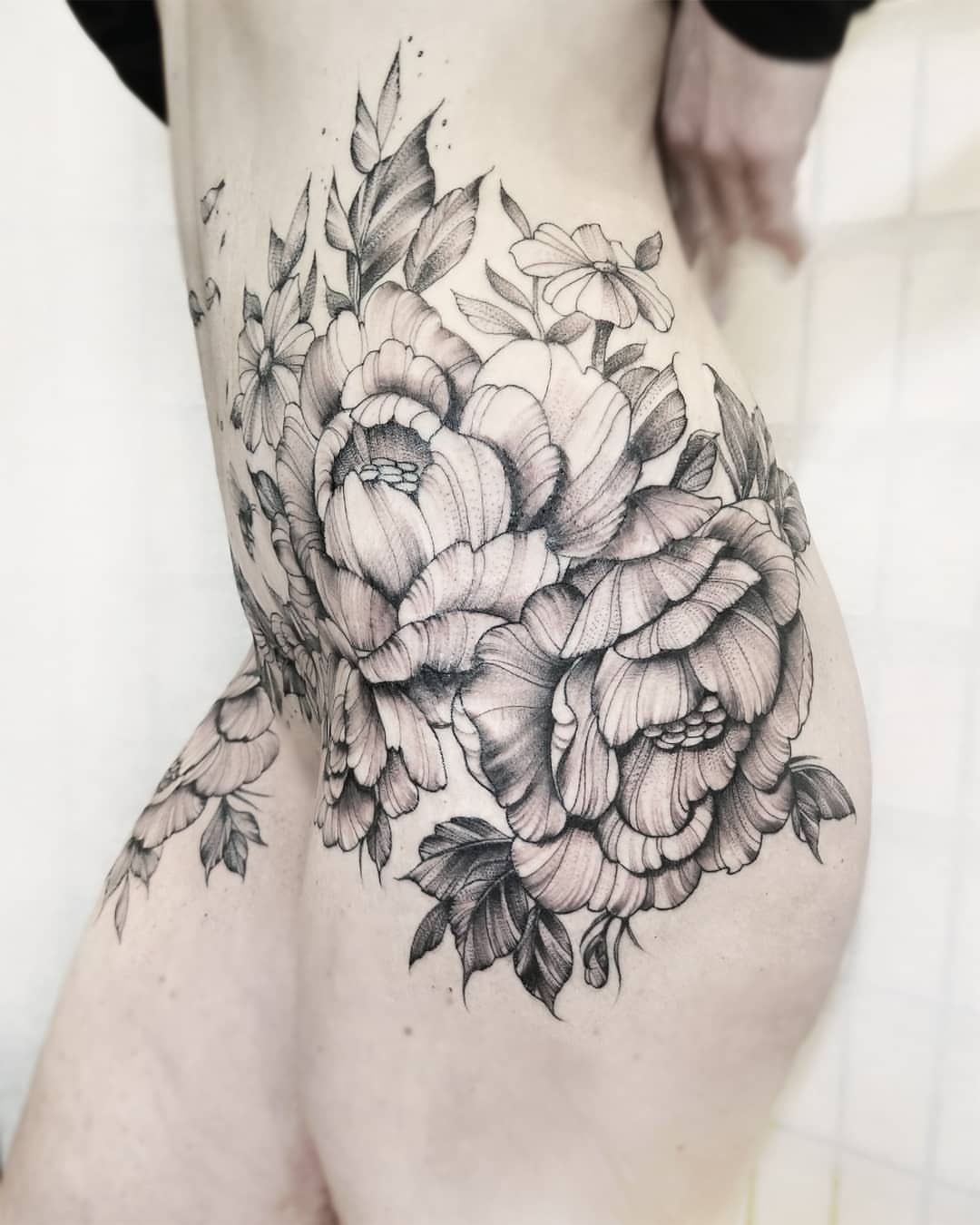 Peony flowers black and grey tattoo on the thigh by Neil Ohmie