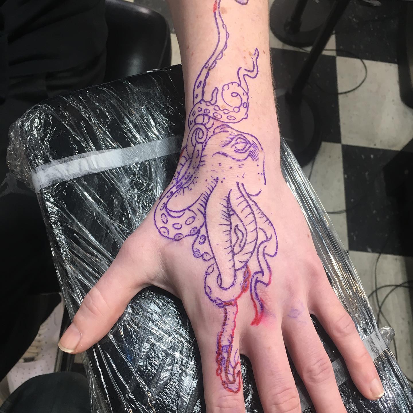 Octopus illustrative tattoo on the hand by Brian Keith