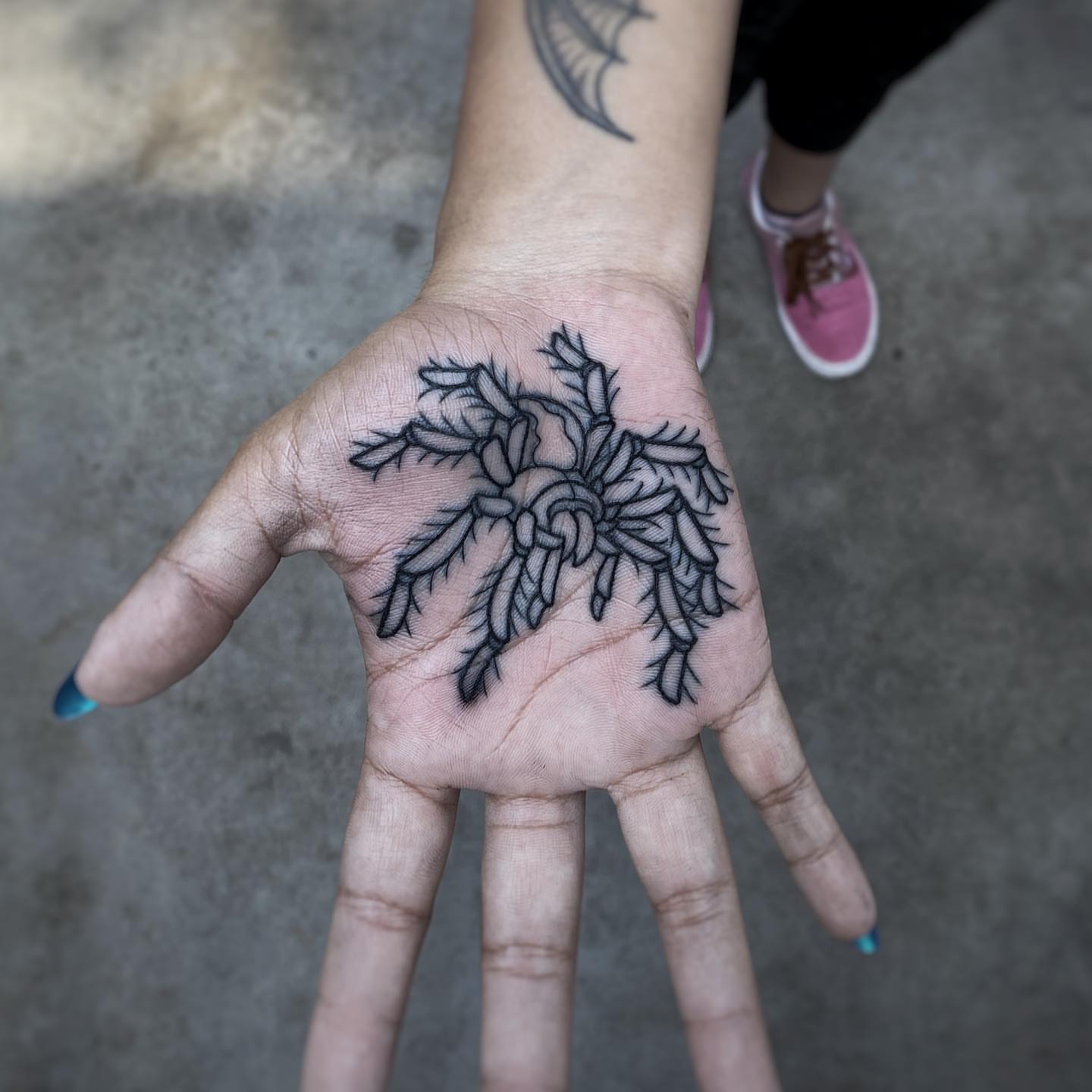 Spider black and grey tattoo on the hand by Mark Walker