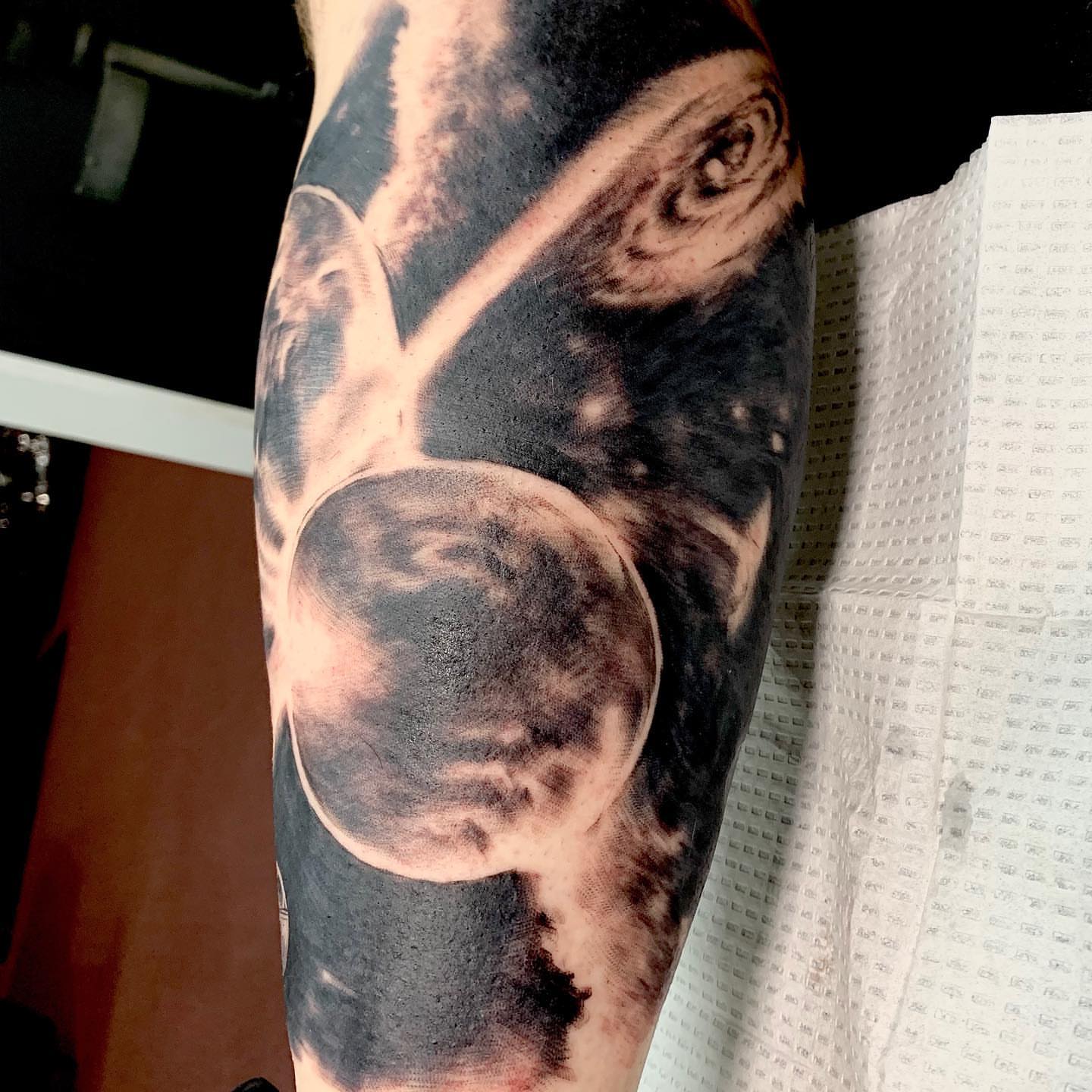 Drum set realism tattoo on the forearm by Trevor Sibary