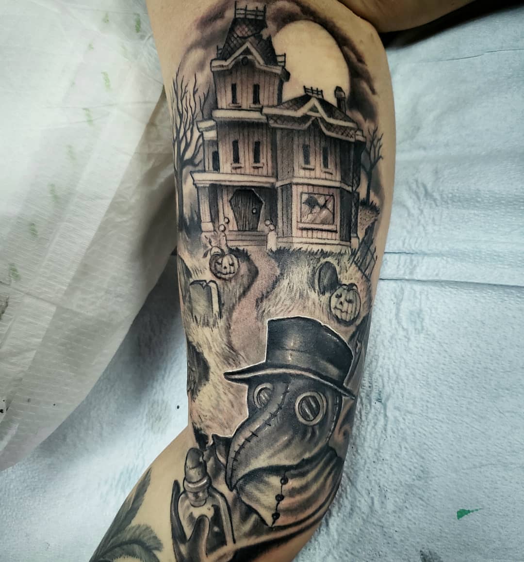 Haunted house and plague doctor realism tattoo on the forearm by Greg West Sac tattoo artist, West Sacramento, California