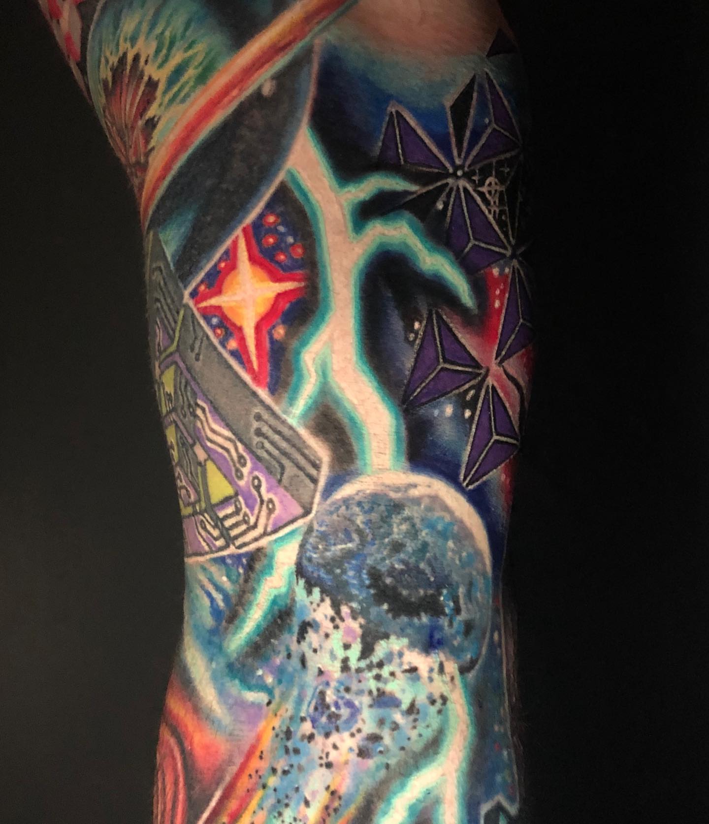 Astronaut and space geometric tattoo on the forearm by Kayden DiGiovanni, Addison, Texas