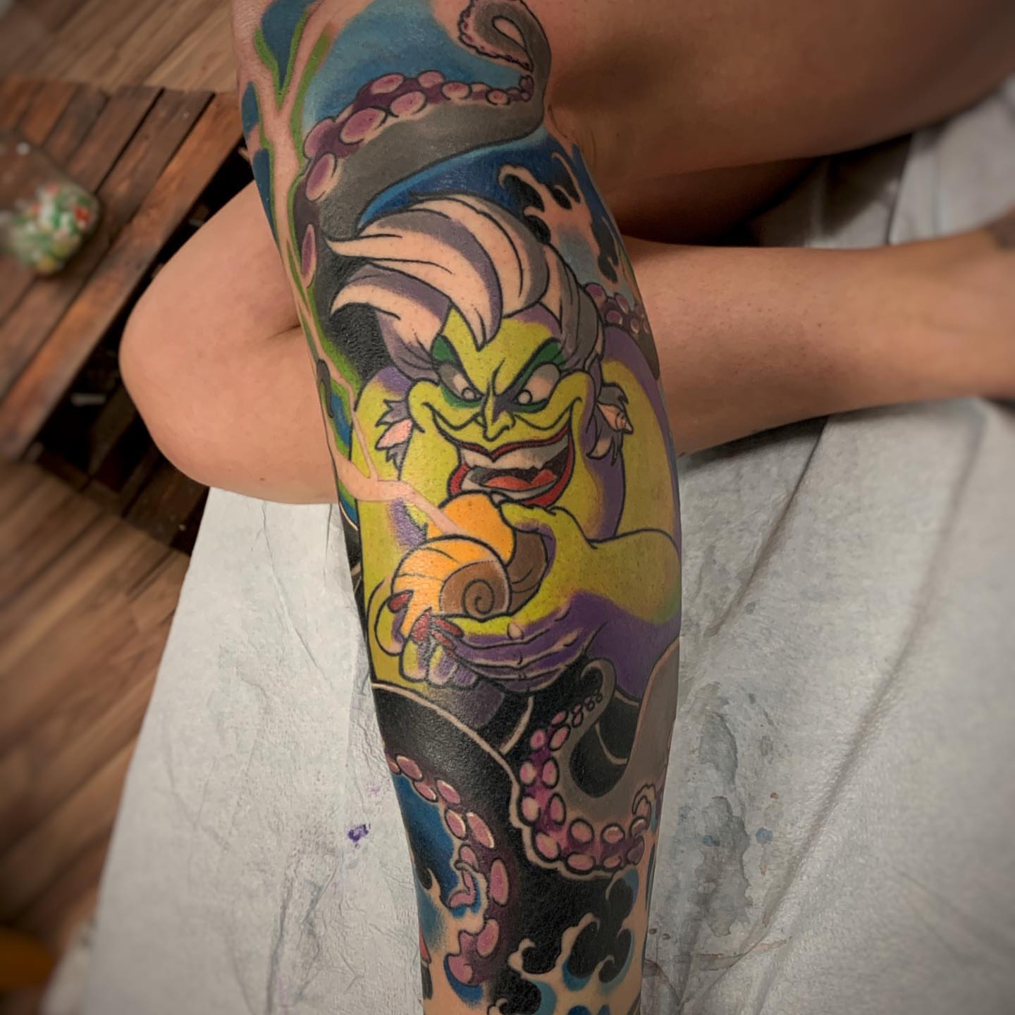 Octopus and sea creature American traditional tattoo on the forearm by Derek Hutchison, Des Moines, Iowa