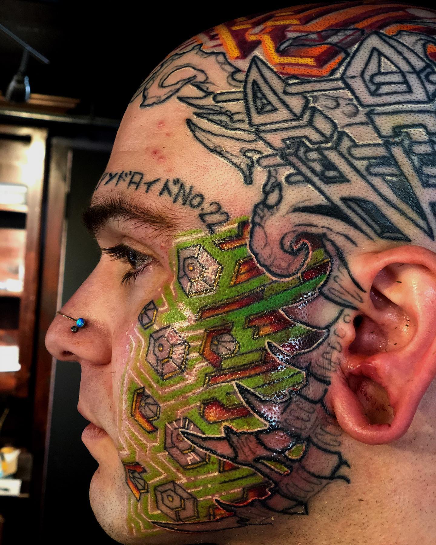 Geometric pattern geometric tattoo on the head by Patrick Delvar