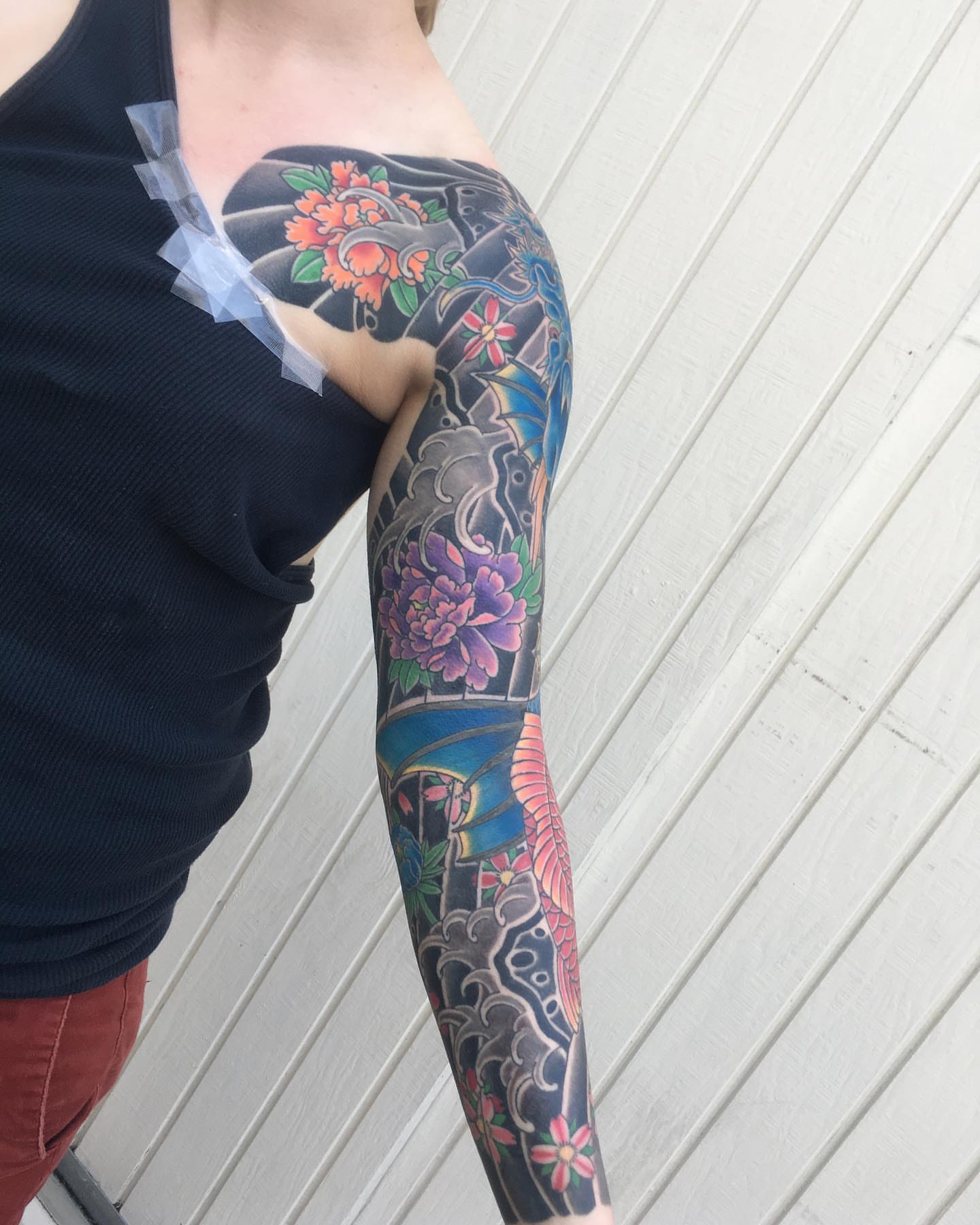 Floral and bird japanese irezumi tattoo on the upper arm by Ei Horimiya Omiya