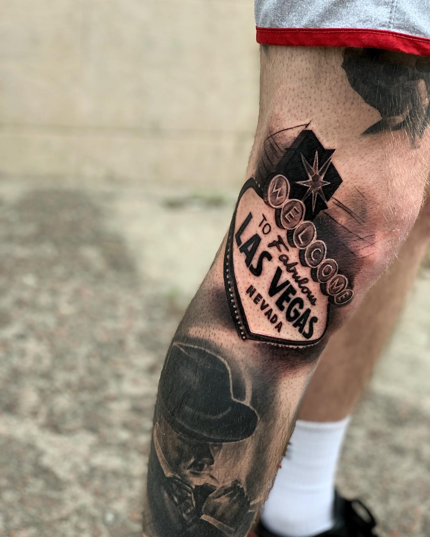 Welcome to Fabulous Las Vegas sign black and grey tattoo on the forearm by Anastasia Ritova