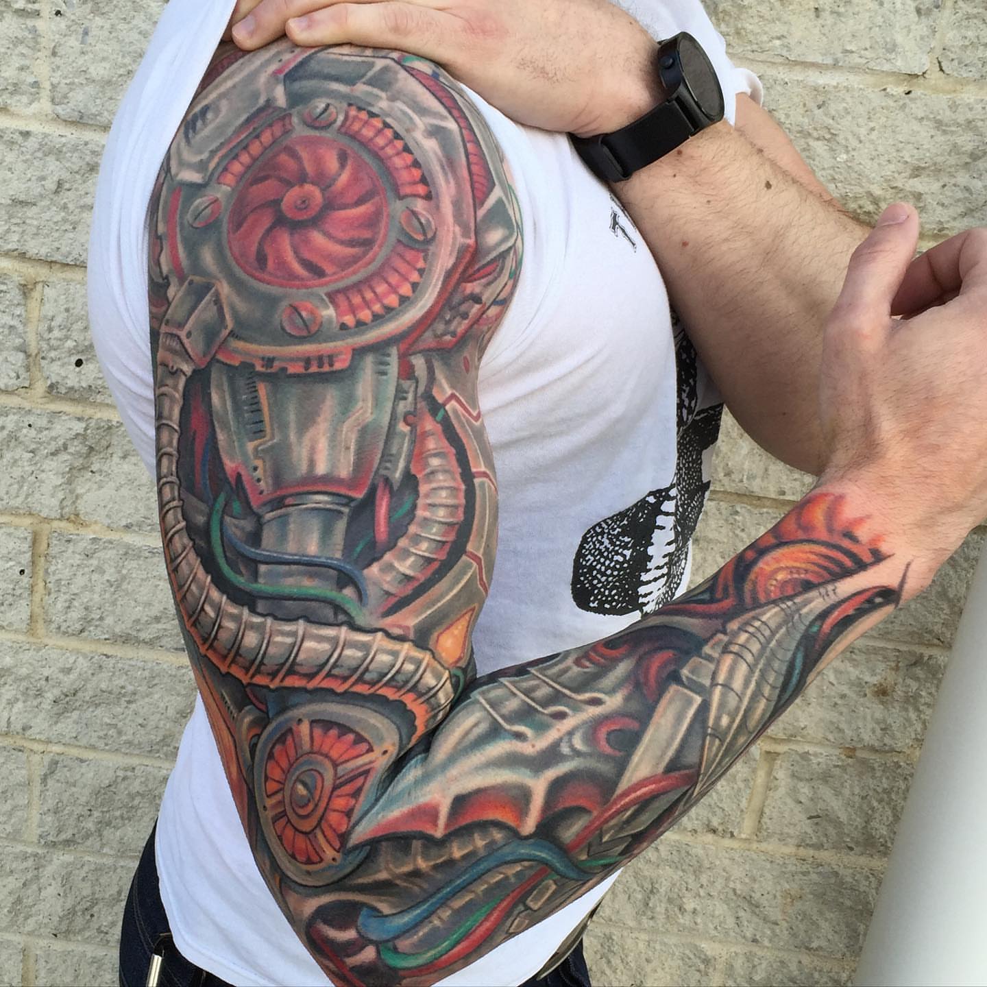 Mechanical engine geometric tattoo on the upper arm by Phil Robertson