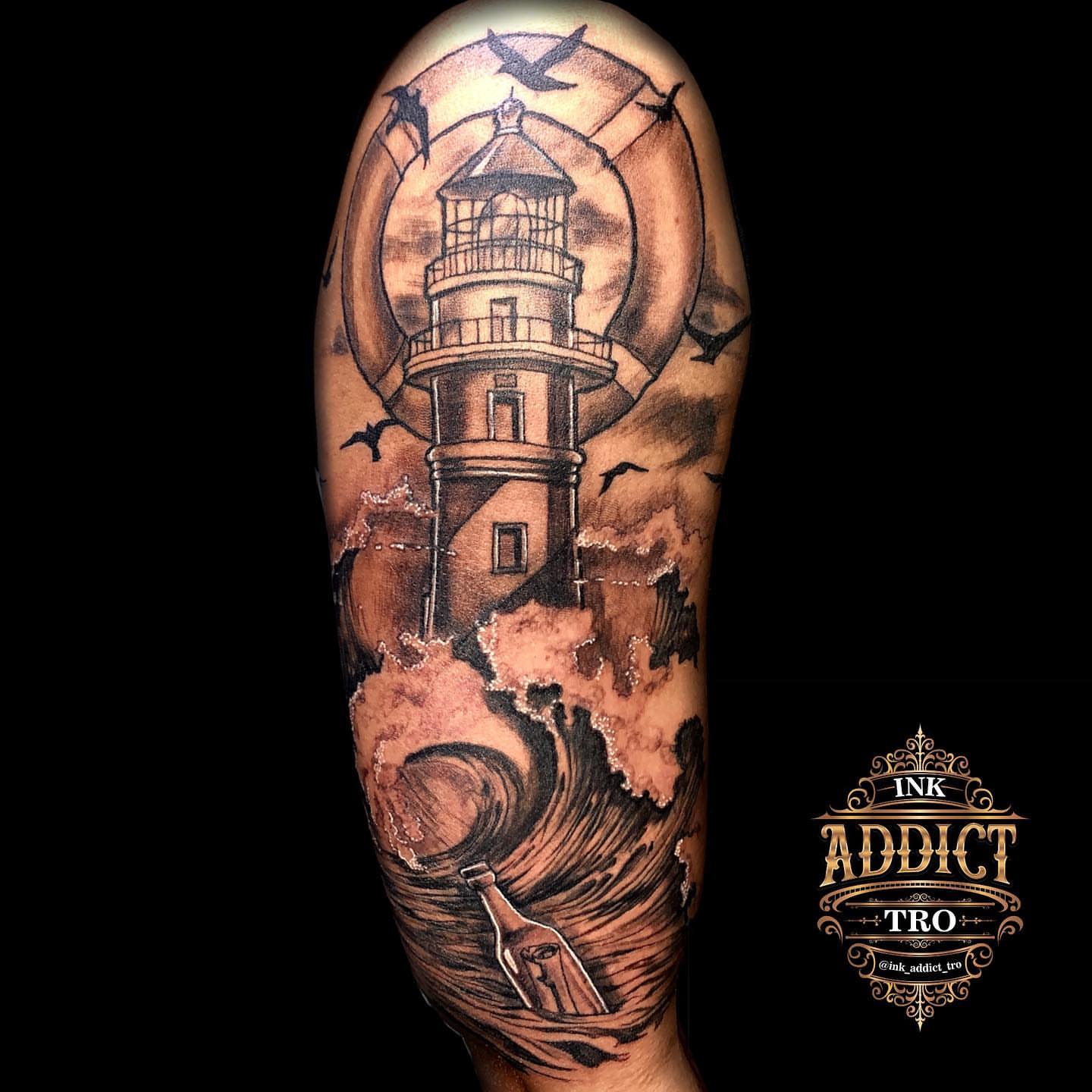 Lighthouse realism tattoo on the forearm by Trocon Talhouk