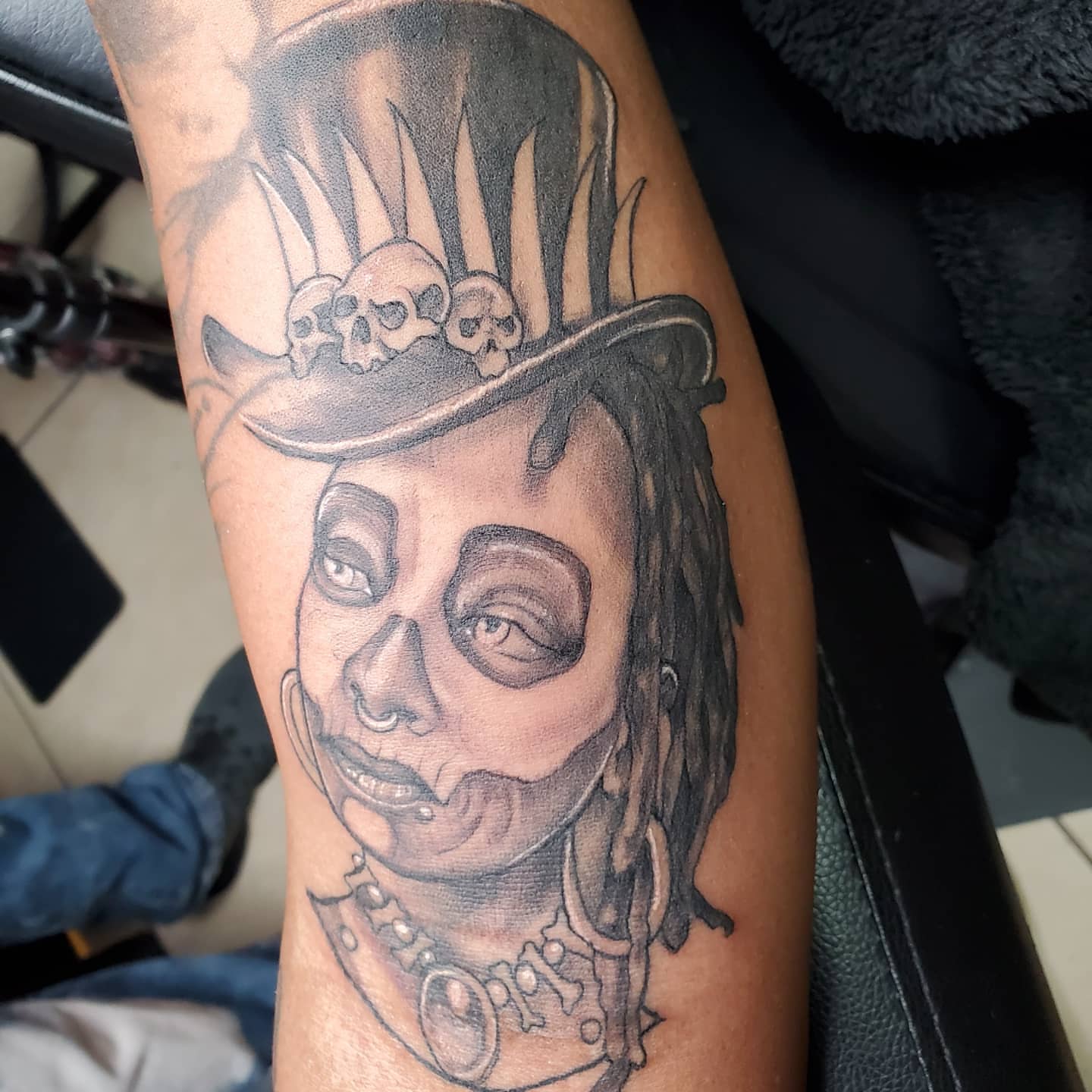 Skull with dreadlocks realism tattoo on the forearm by call (504)441-9275 for info