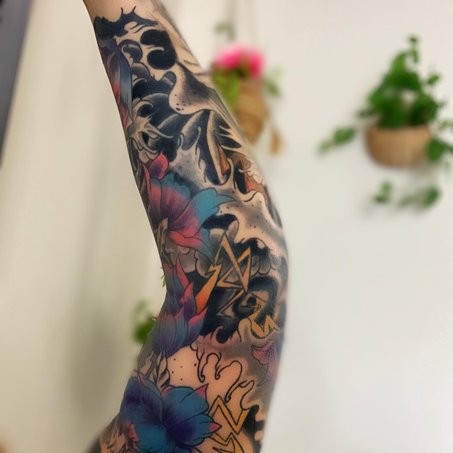Floral and abstract American traditional tattoo on the forearm by Dre Inks