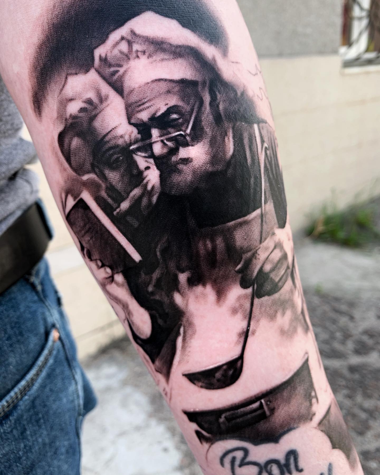 Smoking man black and grey tattoo on the forearm by Anastasia Ritova
