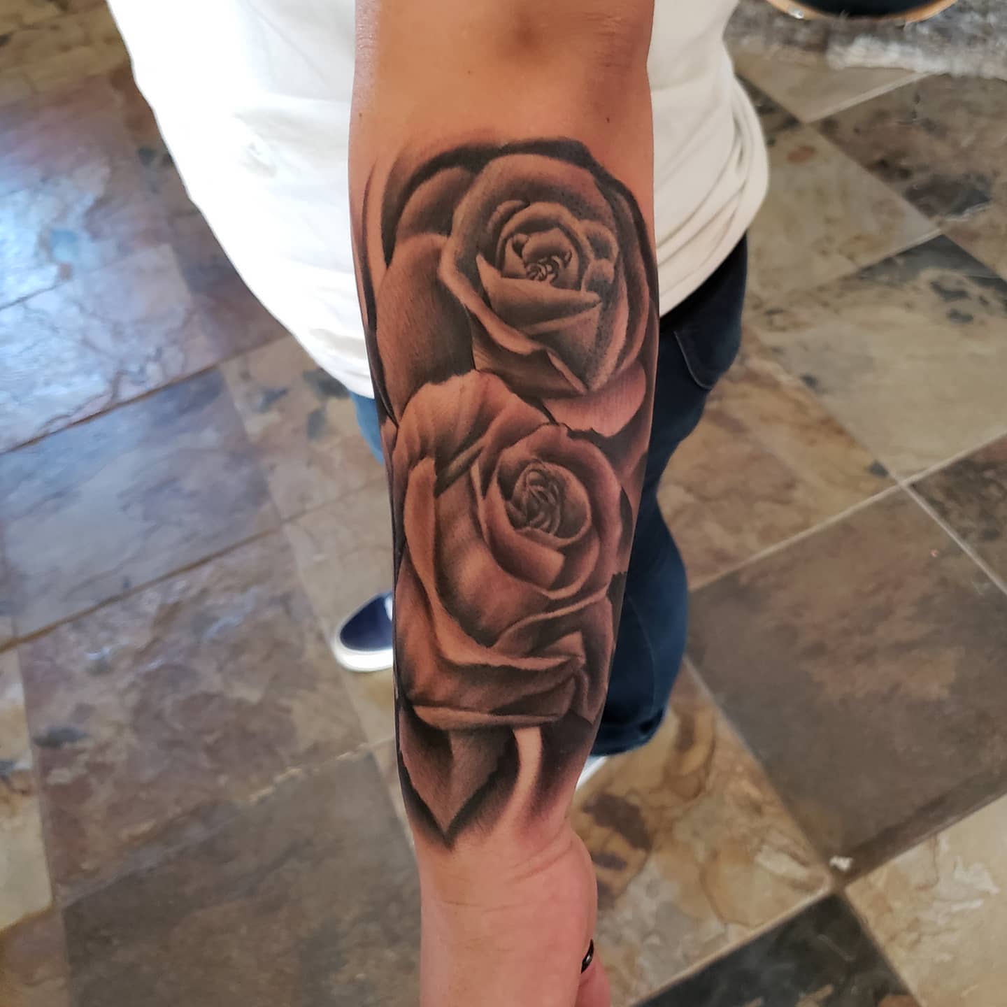 Roses realism tattoo on the forearm by Mark Melanson