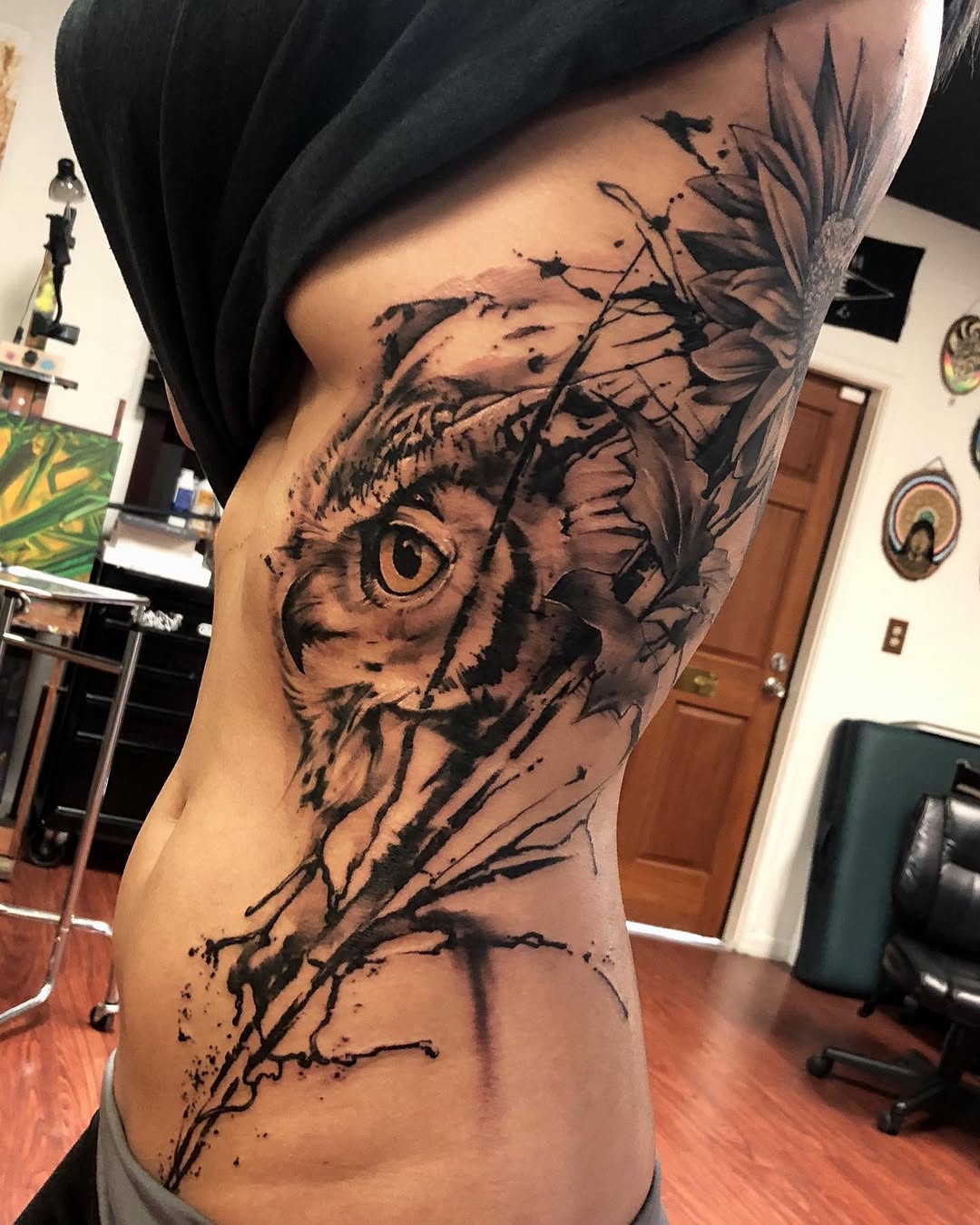 Owl and flowers fine line tattoo on the ribs by David Garner, Los Angeles, California
