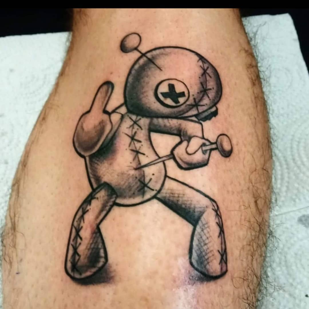 Voodoo doll black and grey tattoo on the forearm by Jacci Gresham