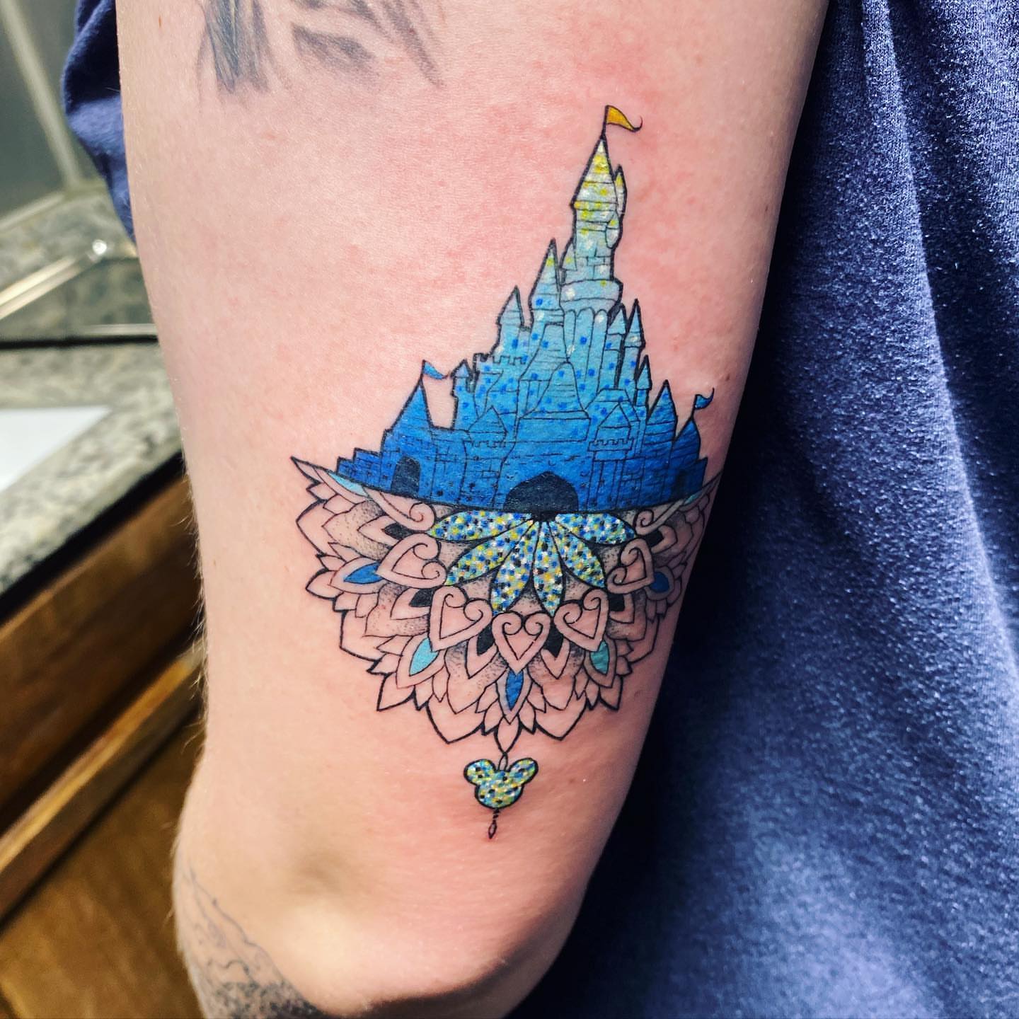 Castle with mandala dotwork tattoo on the forearm by Saint Jimmy